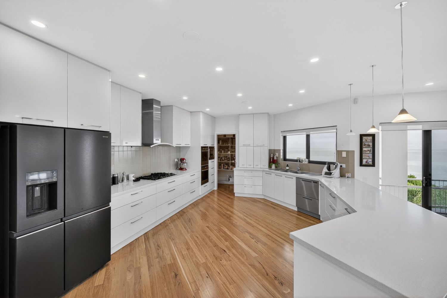 Modern kitchen image showcasing sleek cabinetry, clean lines, contemporary finishes, and natural light highlighting a functional and stylish