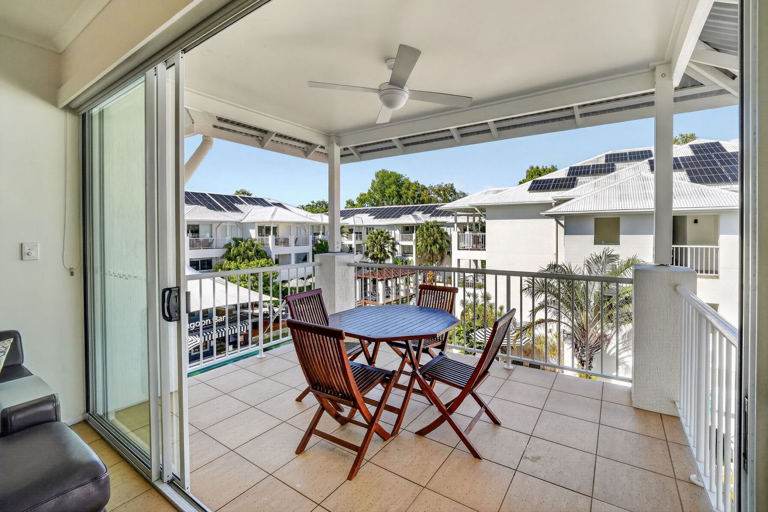 View of holiday apartment balcony, showcasing elevated perspective,resort-style water views, and relaxed coastal atmosphere