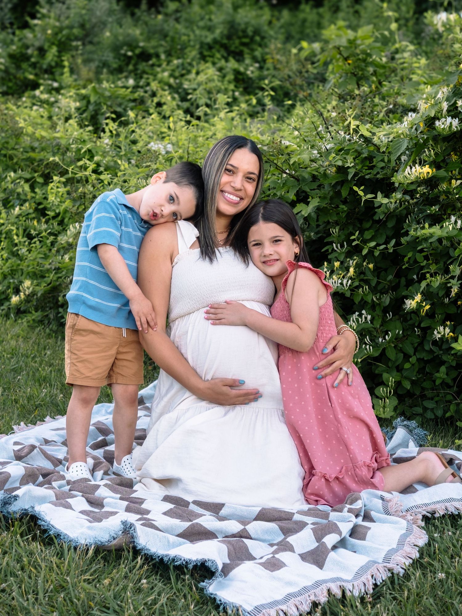 mother and children posing among wildflowers at middle creek