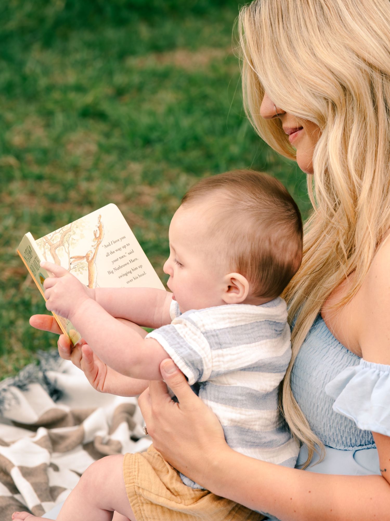 mom and baby reading guess how much I love you book