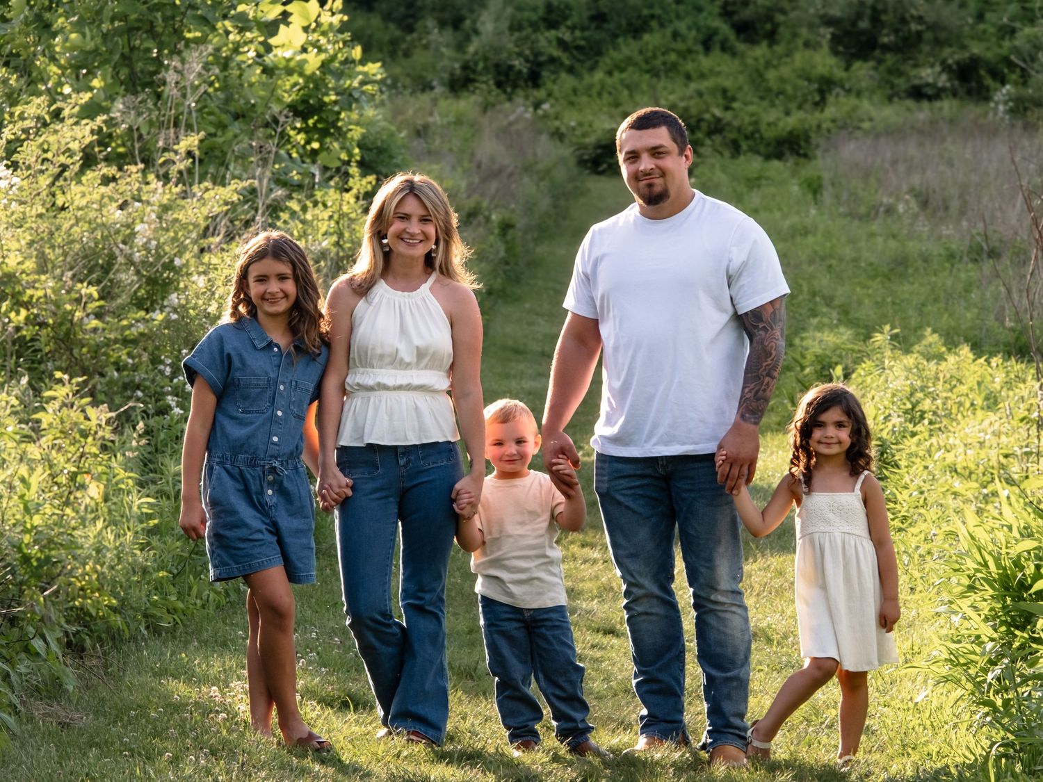 family walking along path at golden hour at middle creek