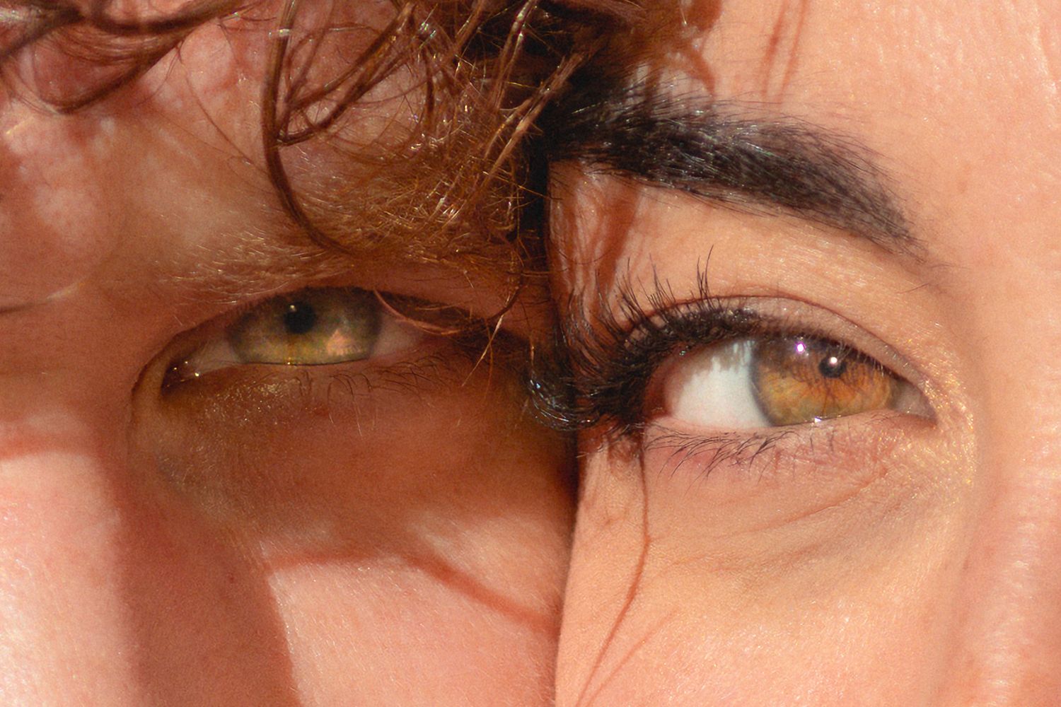 Close-up of two peoples eyes pressed together, showcasing hazel and green eyes with natural lighting in Littleton, Colorado.