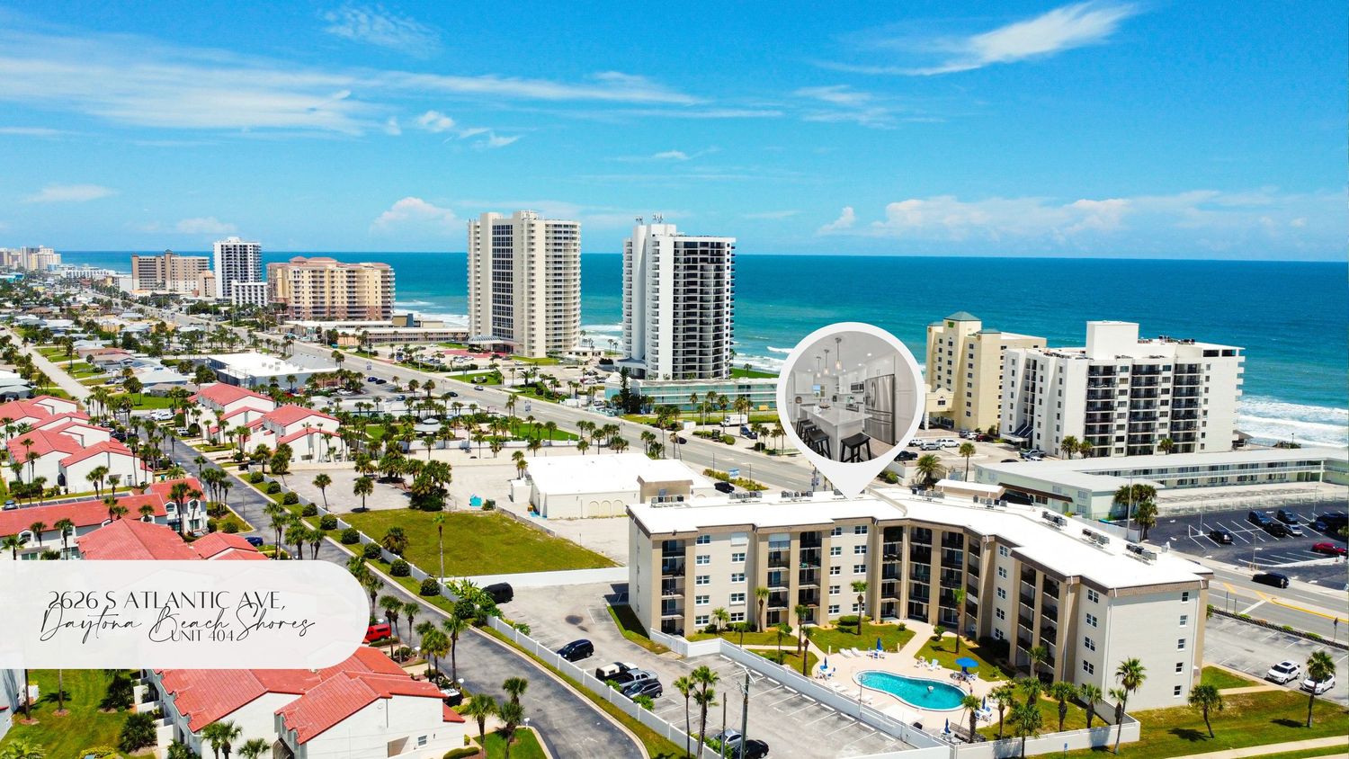 Aerial view of Daytona Beach skyline showing oceanfront condos and the iconic observation wheel.