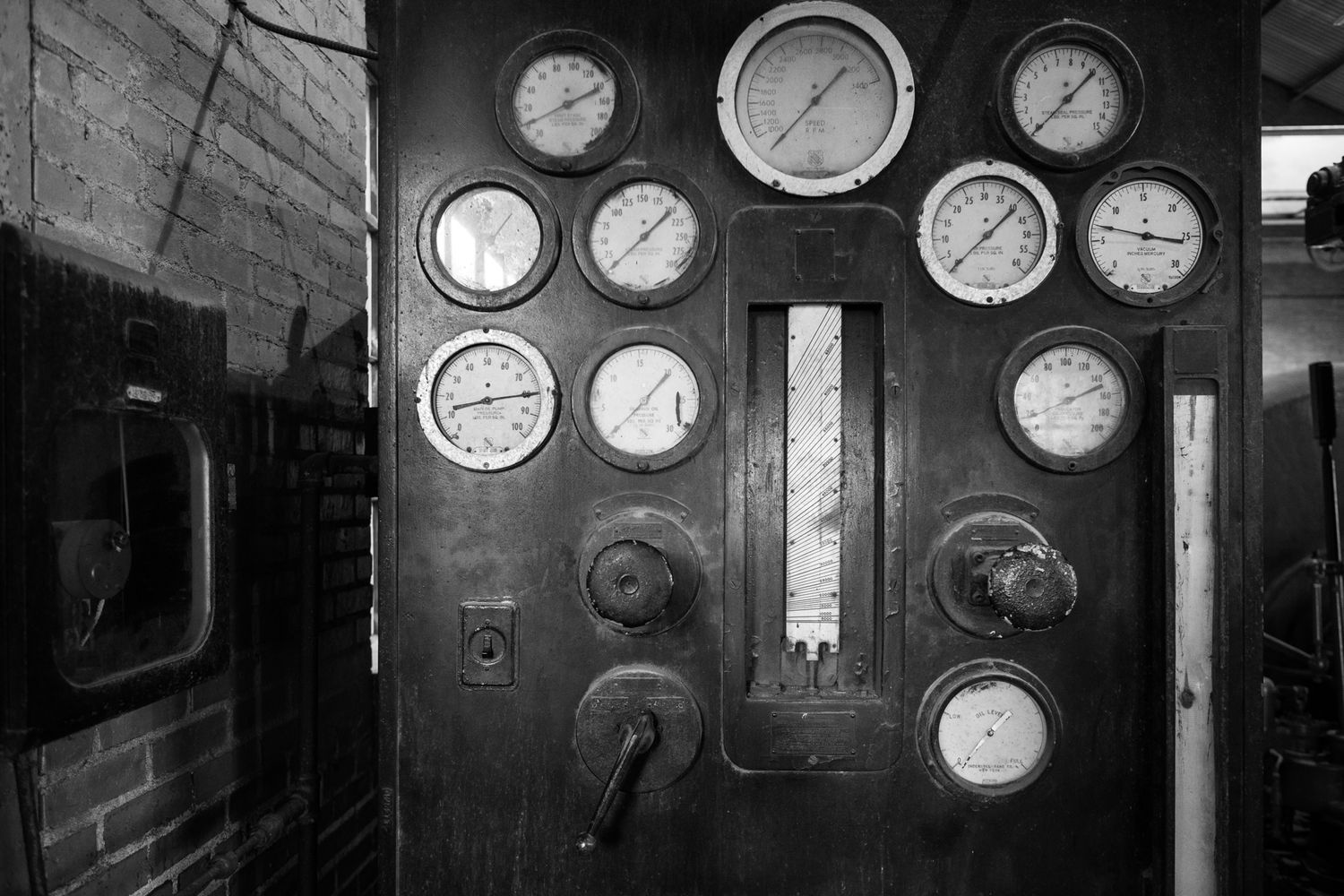 A black and white interior scene at an iron mill
