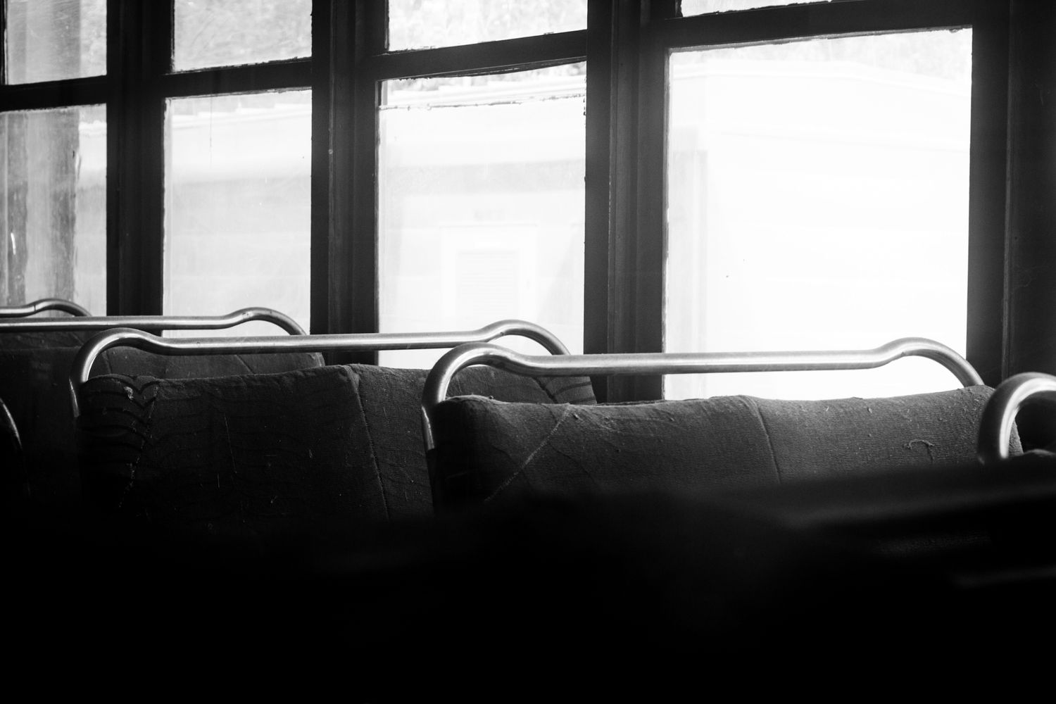 A black and white photo of the interior of a vintage train car