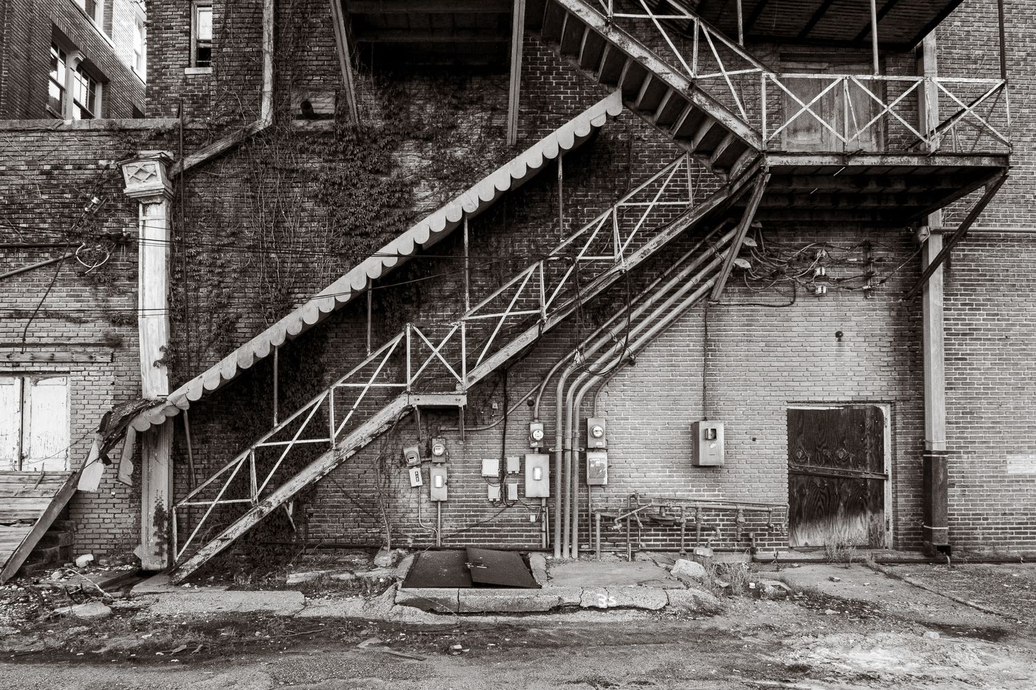 A black and white photo of an alley exterior staircase in Clarksdale Mississippi