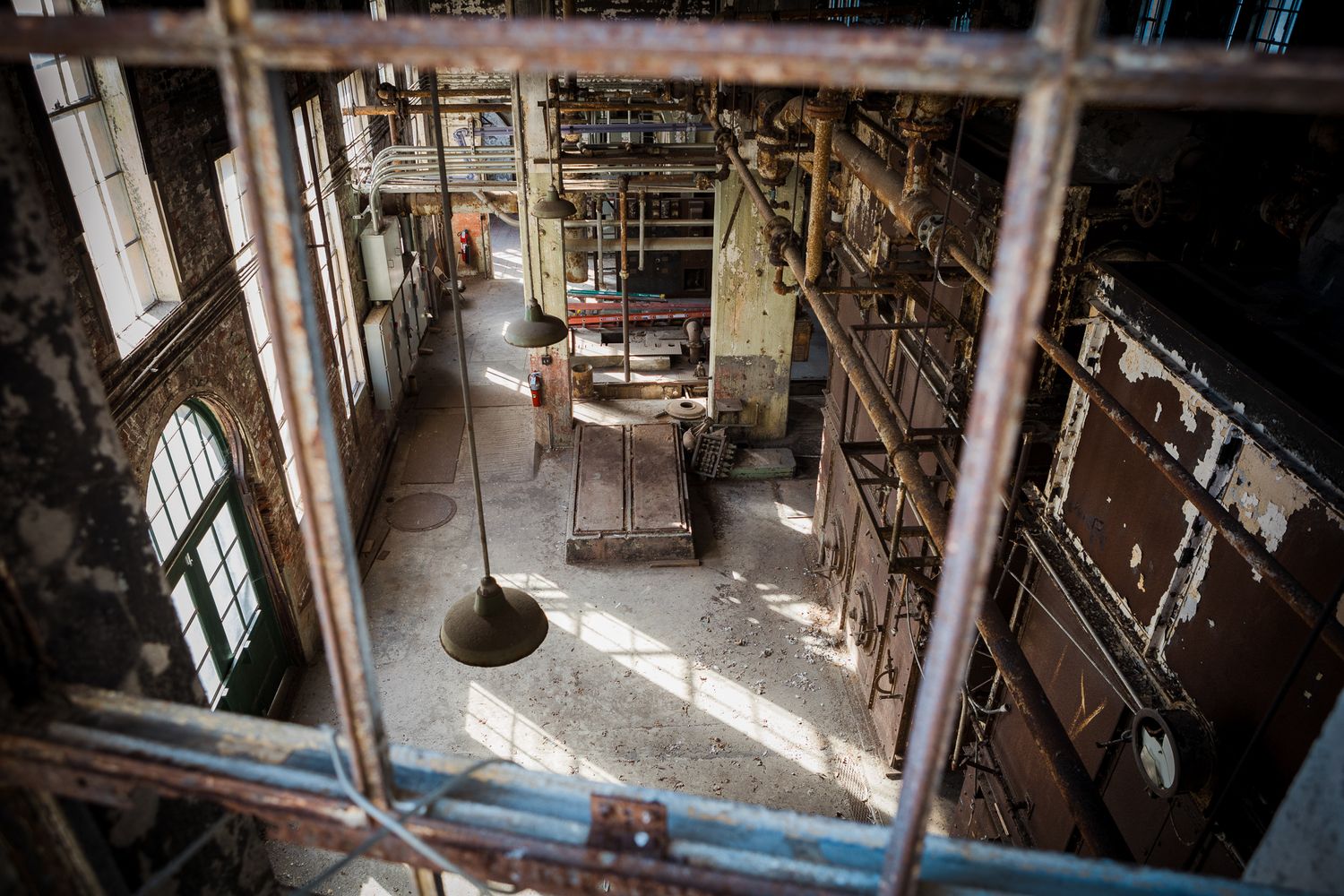 An interior view of the lower floor of an abandoned factory