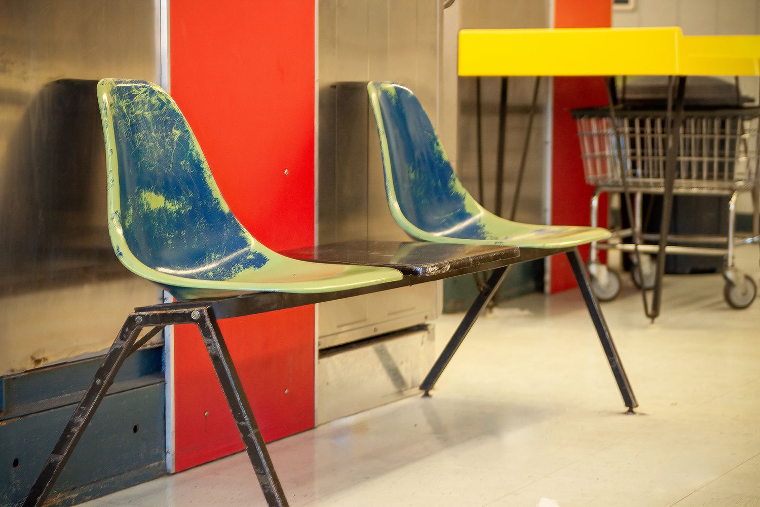 Two empty and aged chairs at a laundromat in Glen St Mary Florida