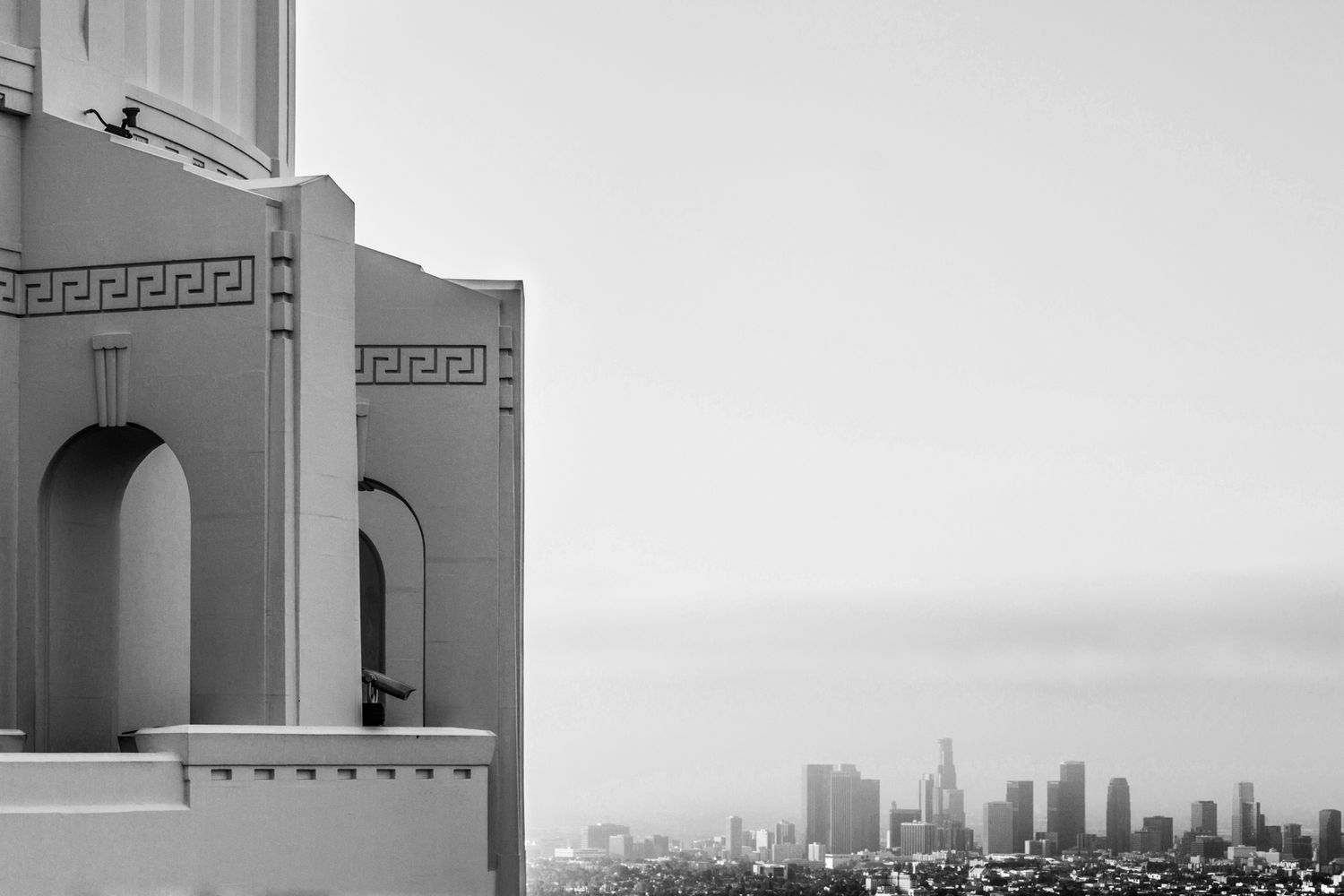 A black and white view of the skyline of downtown Los Angeles as seen from the Griffith Observatory