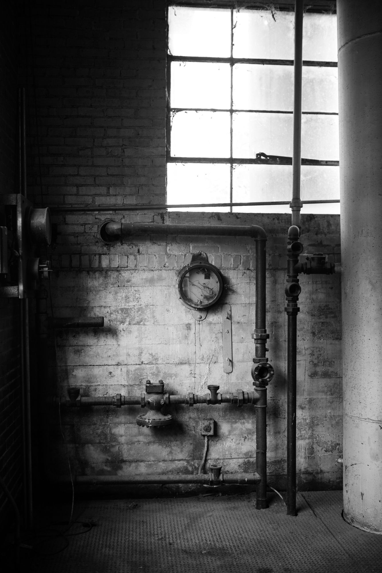 A black and white interior scene at an iron mill