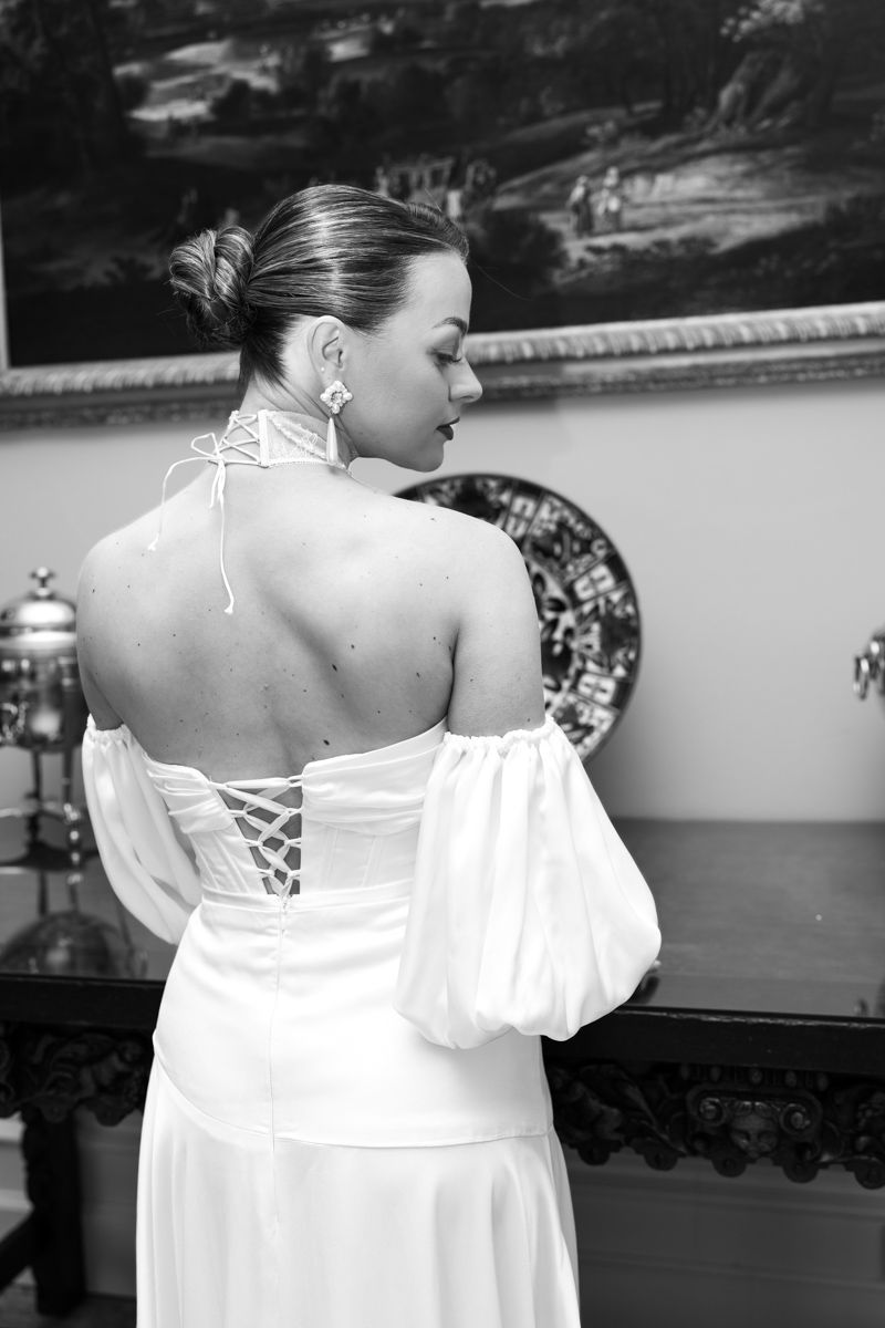 Bride editorial portrait by the window in Capesthorne Hall - editorial wedding photographer in Cheshire