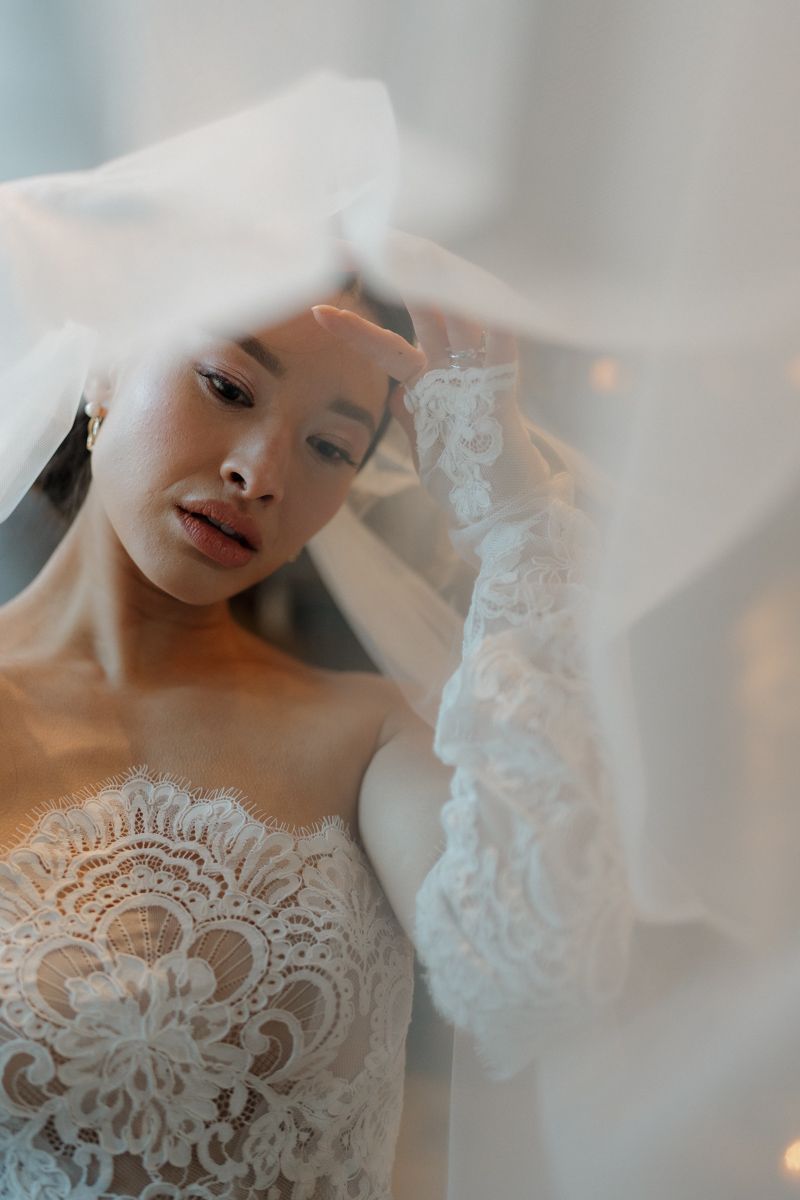 Bride portrait with her veil in a church in Peak district - editorial wedding photographer Peak District