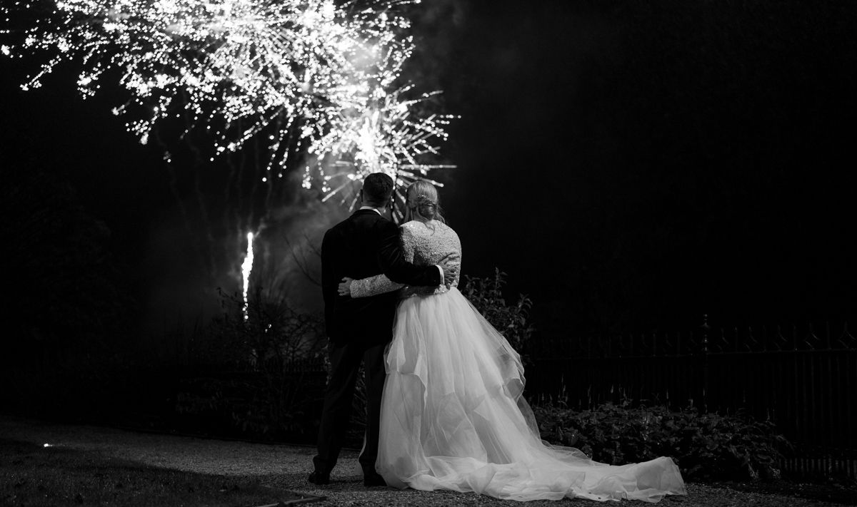 Bride and groom watching fireworks display at Bowcliffe Hall - editorial wedding photography Yorkshire