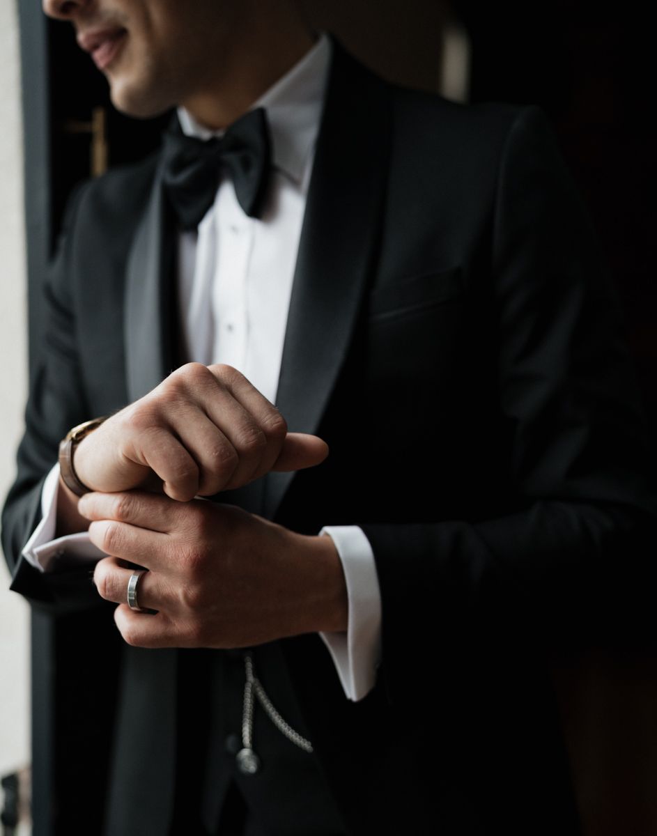 Groom portrait by the window at Capesthorne Hall in Castlefields rooms, Manchester - editorial wedding photographer  Manchester