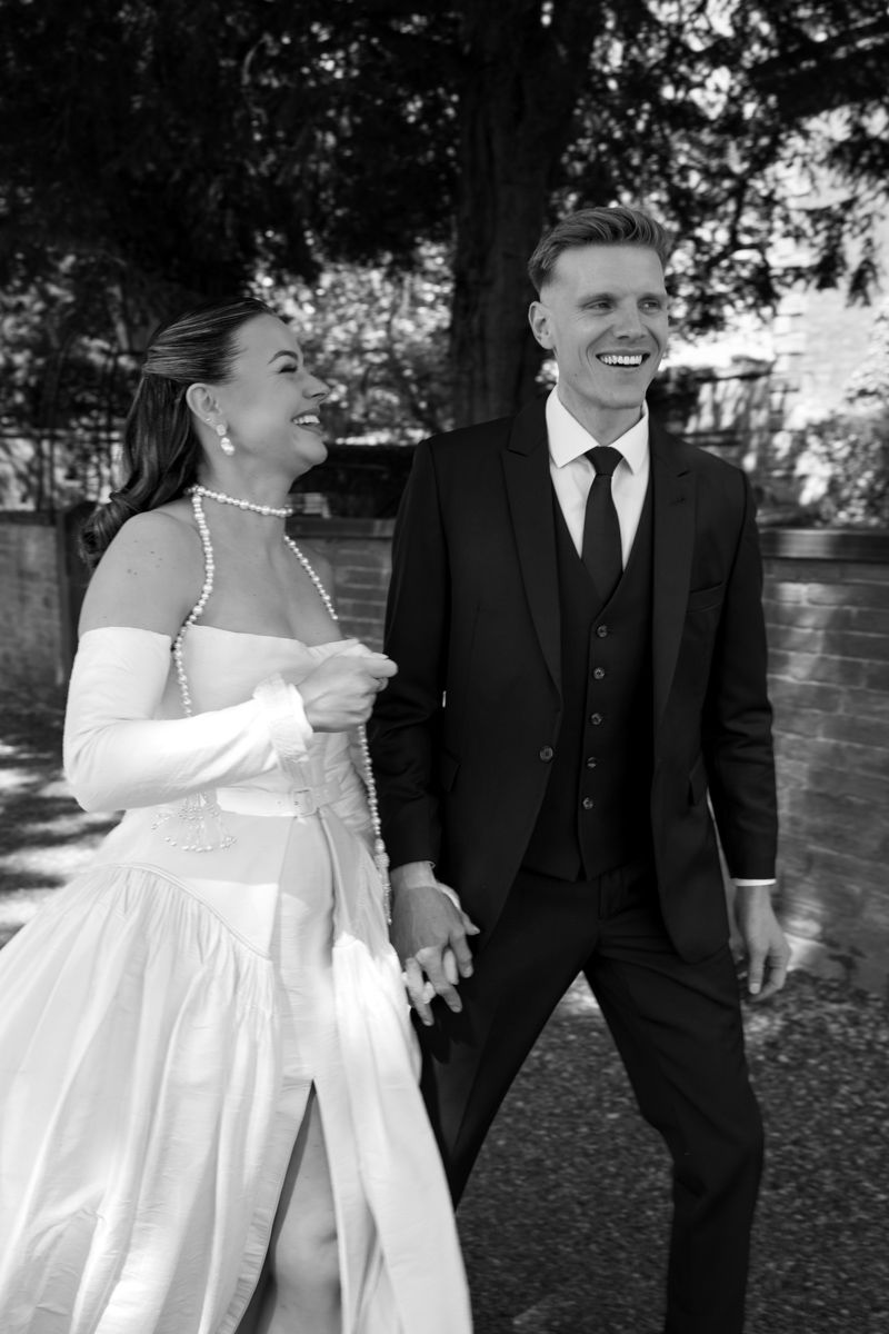 Bride and groom laughing candid portrait in Manchester - editorial wedding photographer Manchester