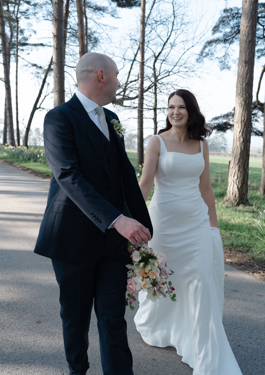 Bride and groom walking the grounds at The Hovels at Harewood Estate- editorial wedding photography Yorkshire