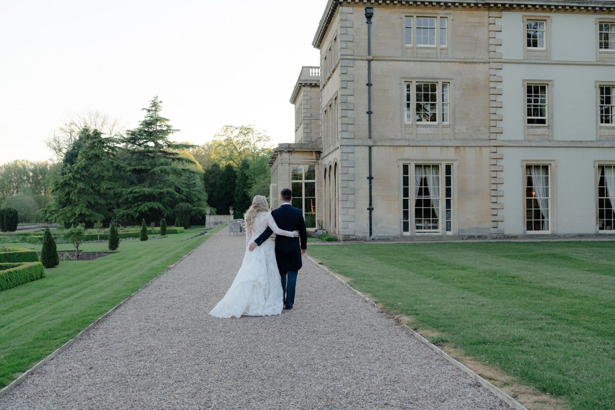 Bride and groom walking the grounds at Prestwold Hall - timeless editorial wedding photography Leicestershire