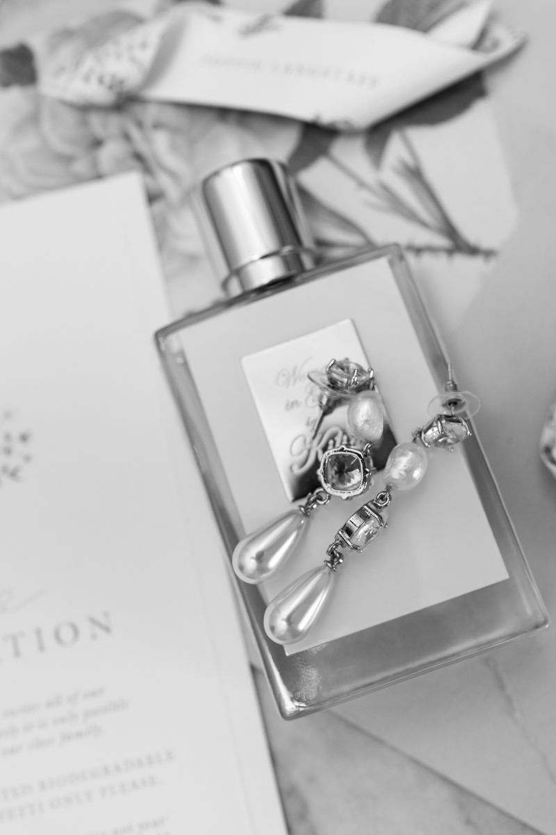 wedding details film shot - bride perfume and accessories