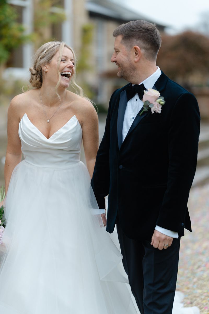 Bride and groom laughing portrait - timeless elegant wedding photography Cheshire