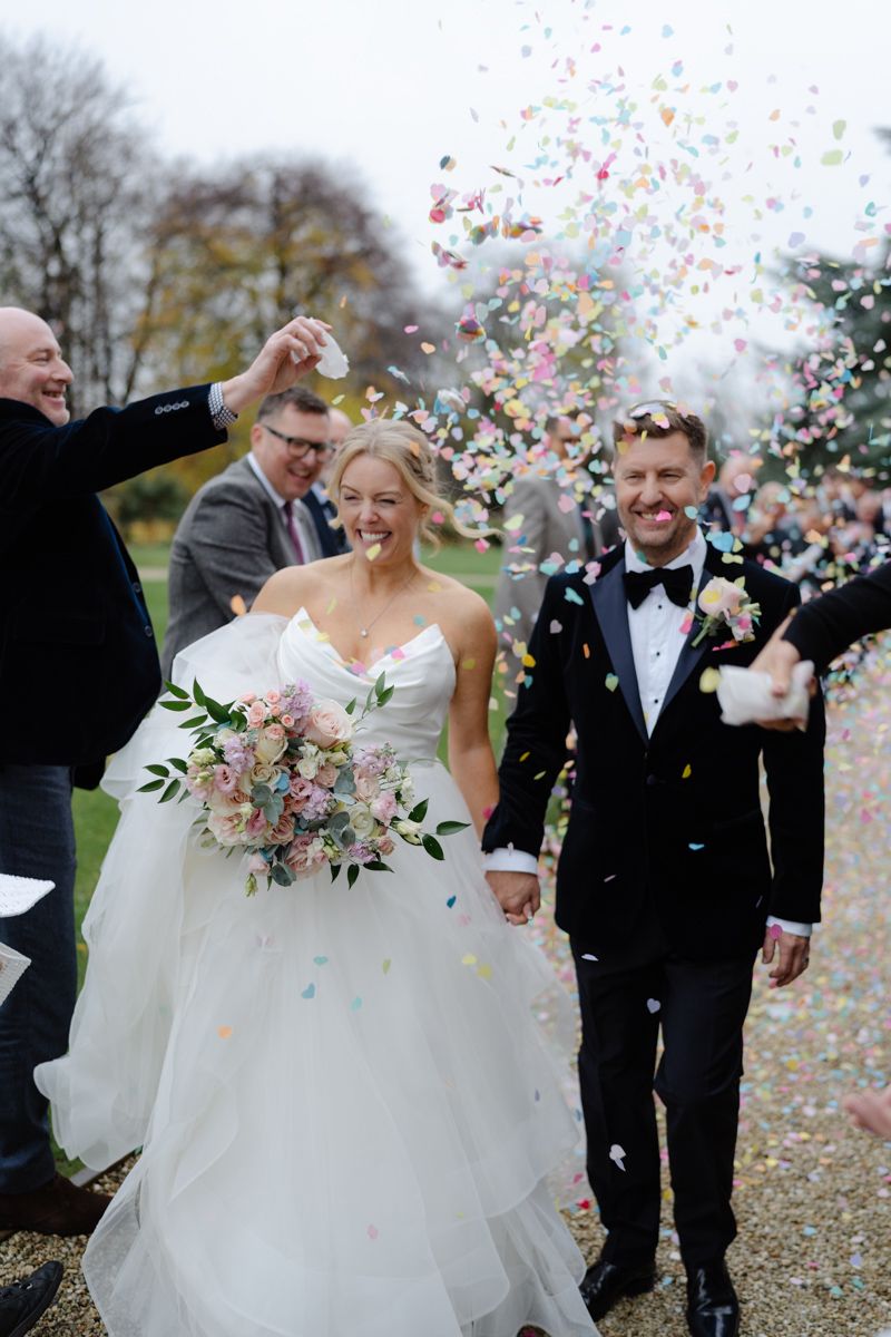 Bride and groom confetti shot at Bowcliffe Hall - editorial wedding photographer Yorkshire