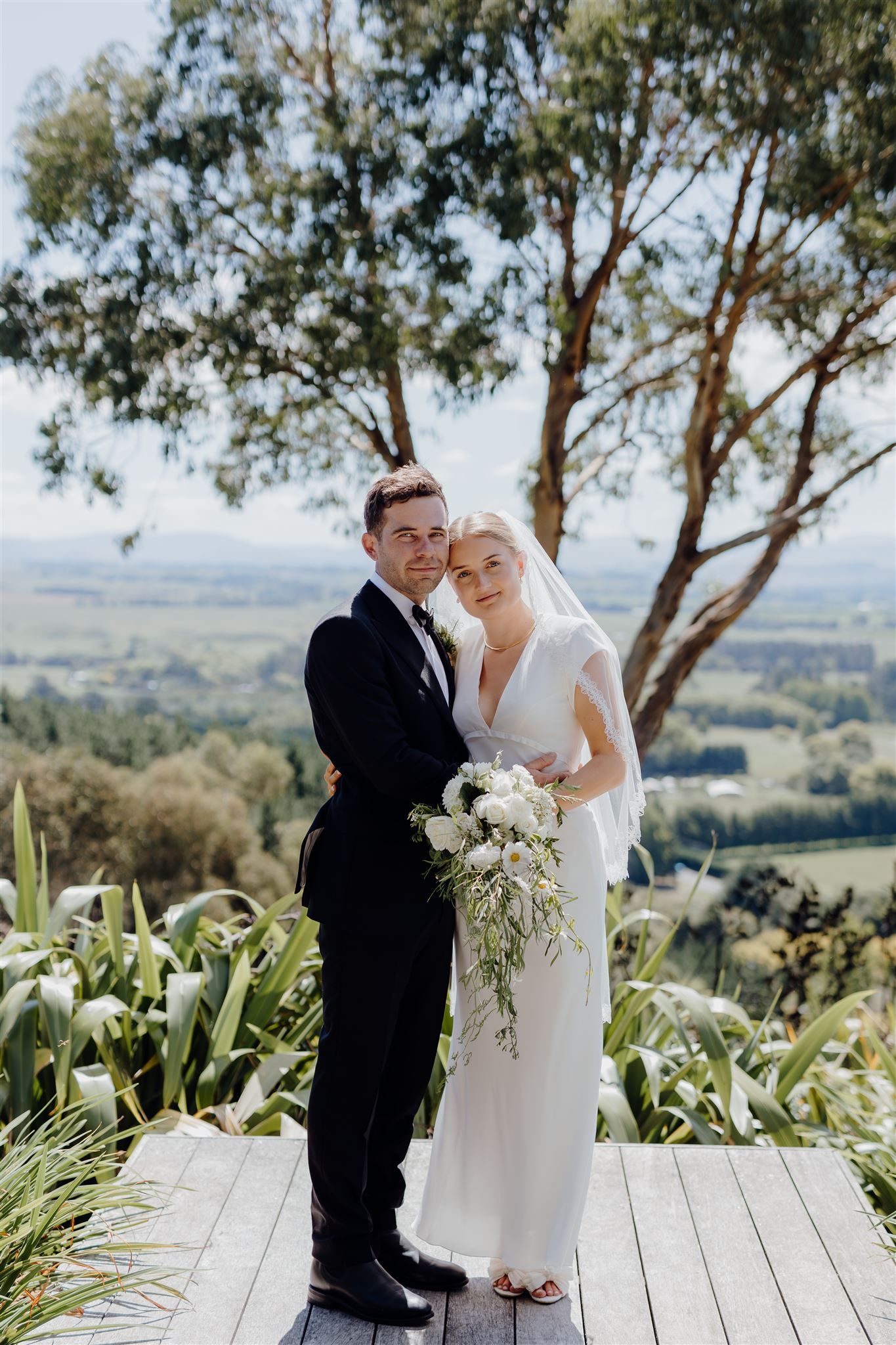 Ella and Jono posing for their wedding portraits in Maraekakaho while photographed by Hawkes Bay Wedding photographer Charlotte Rowlands
