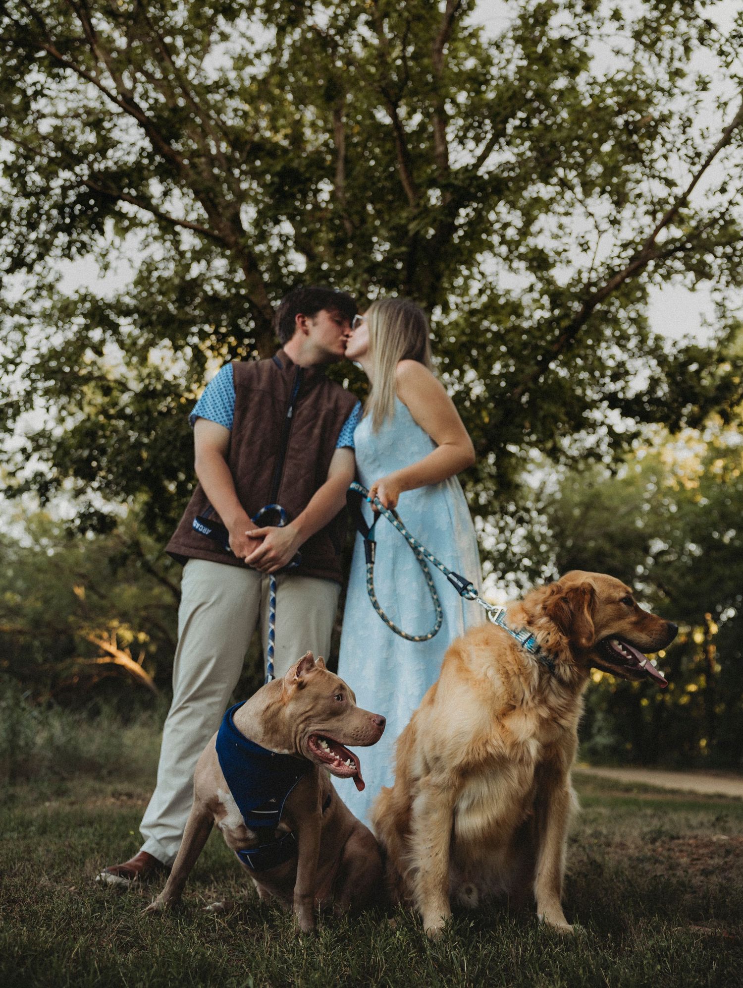 Couple with their dogs at park in Abilene,TX