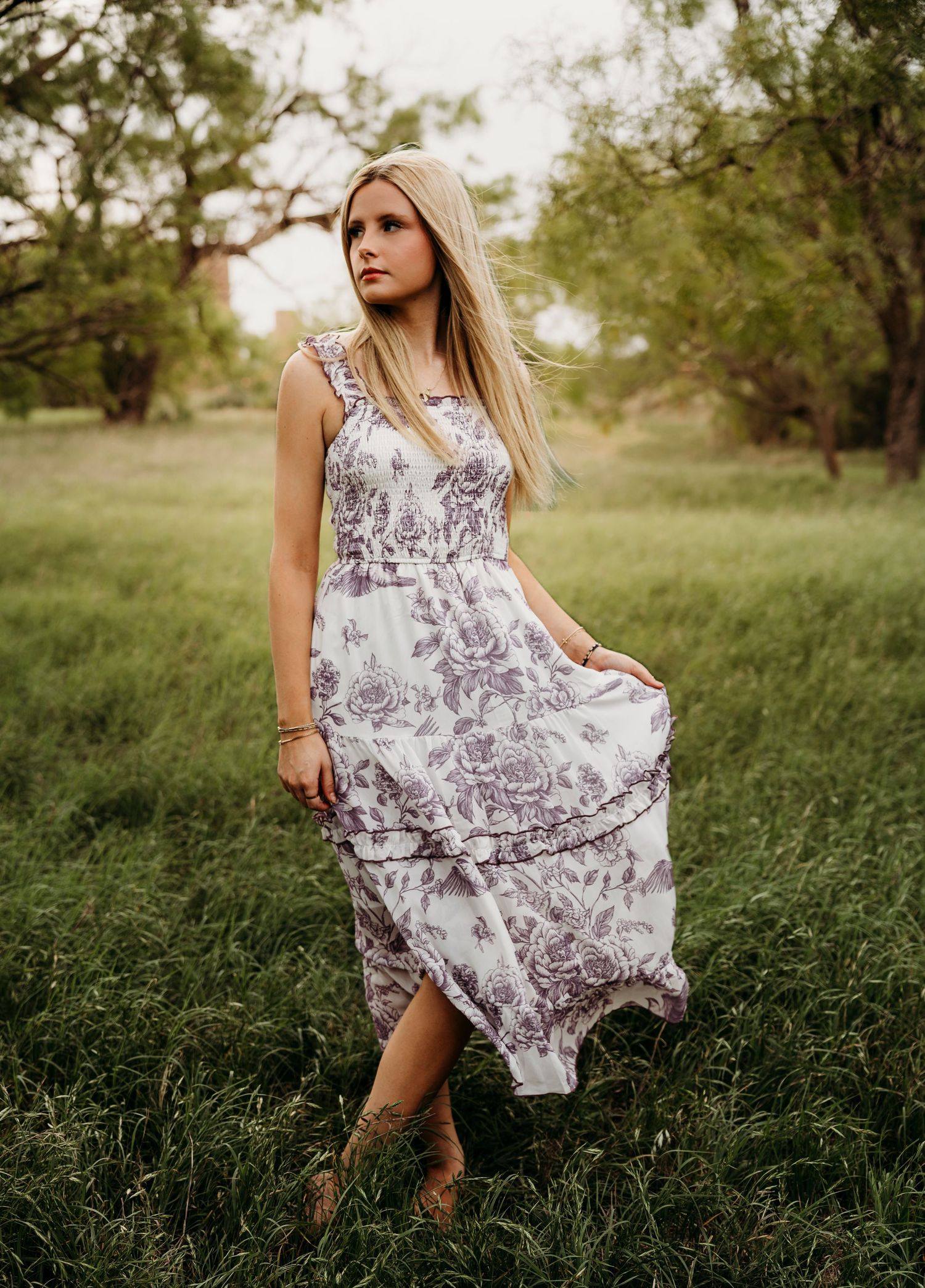 Senior girl portrait session in a dreamy outdoor field in Abilene, TX.