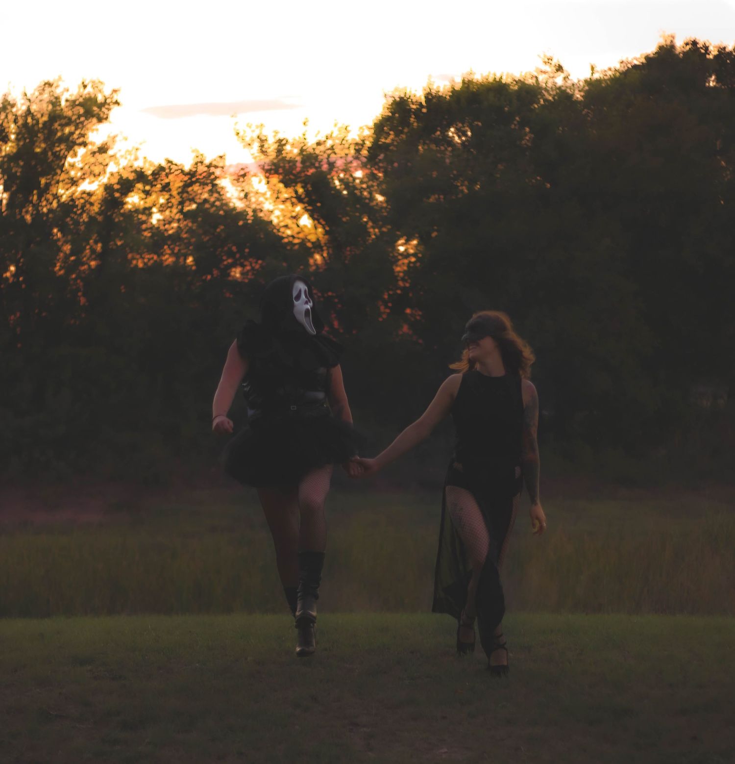 Artistic creative portrait session in Abilene TX capturing movement and connection during a Halloween styled photoshoot