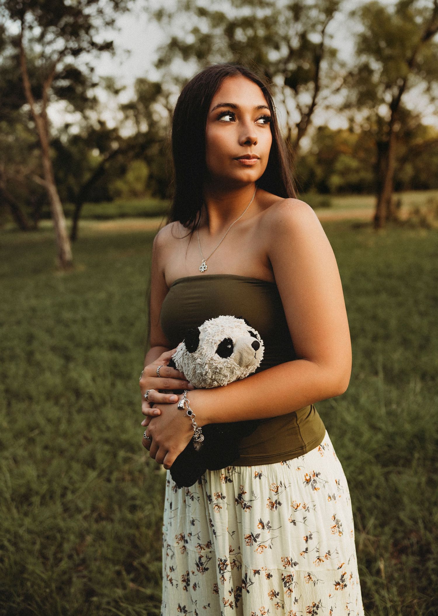 Class of 2027 senior portraits with a stuffed animal during a golden hour senior session in Abilene, Texas.
