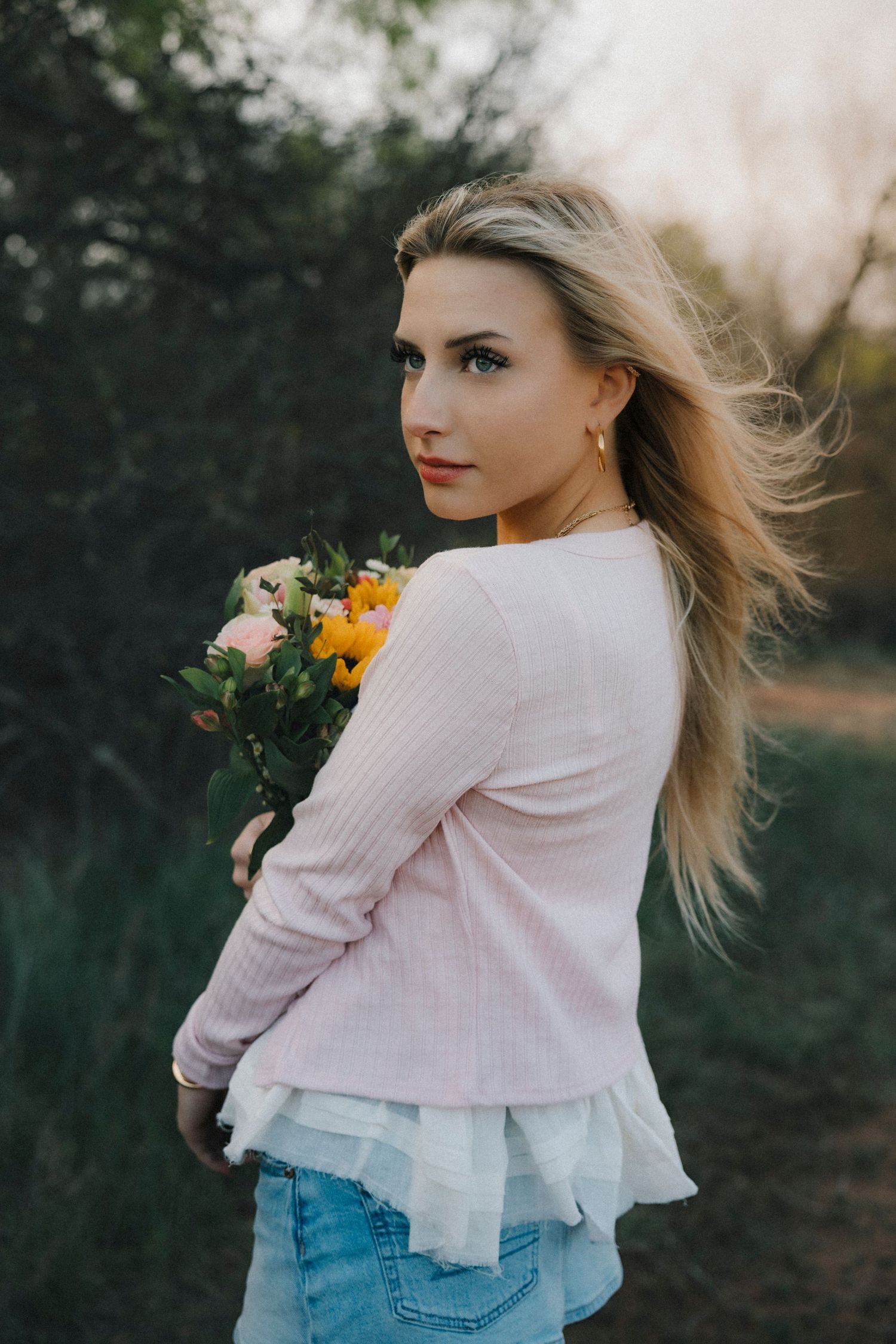 Outdoor senior portrait session in Abilene, TX with soft, cinematic lighting.