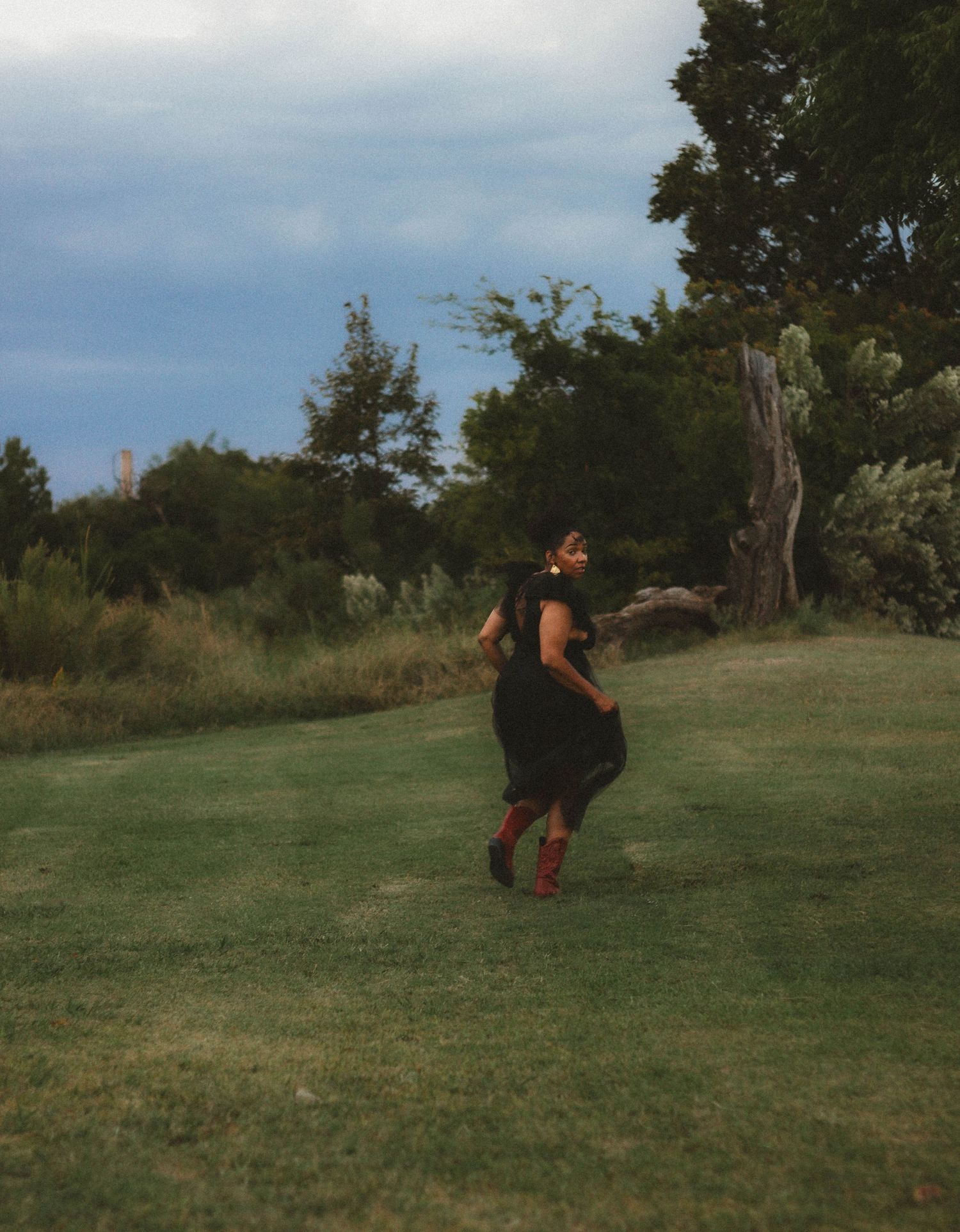 Creative outdoor celebration portrait session in Abilene TX with movement and natural light