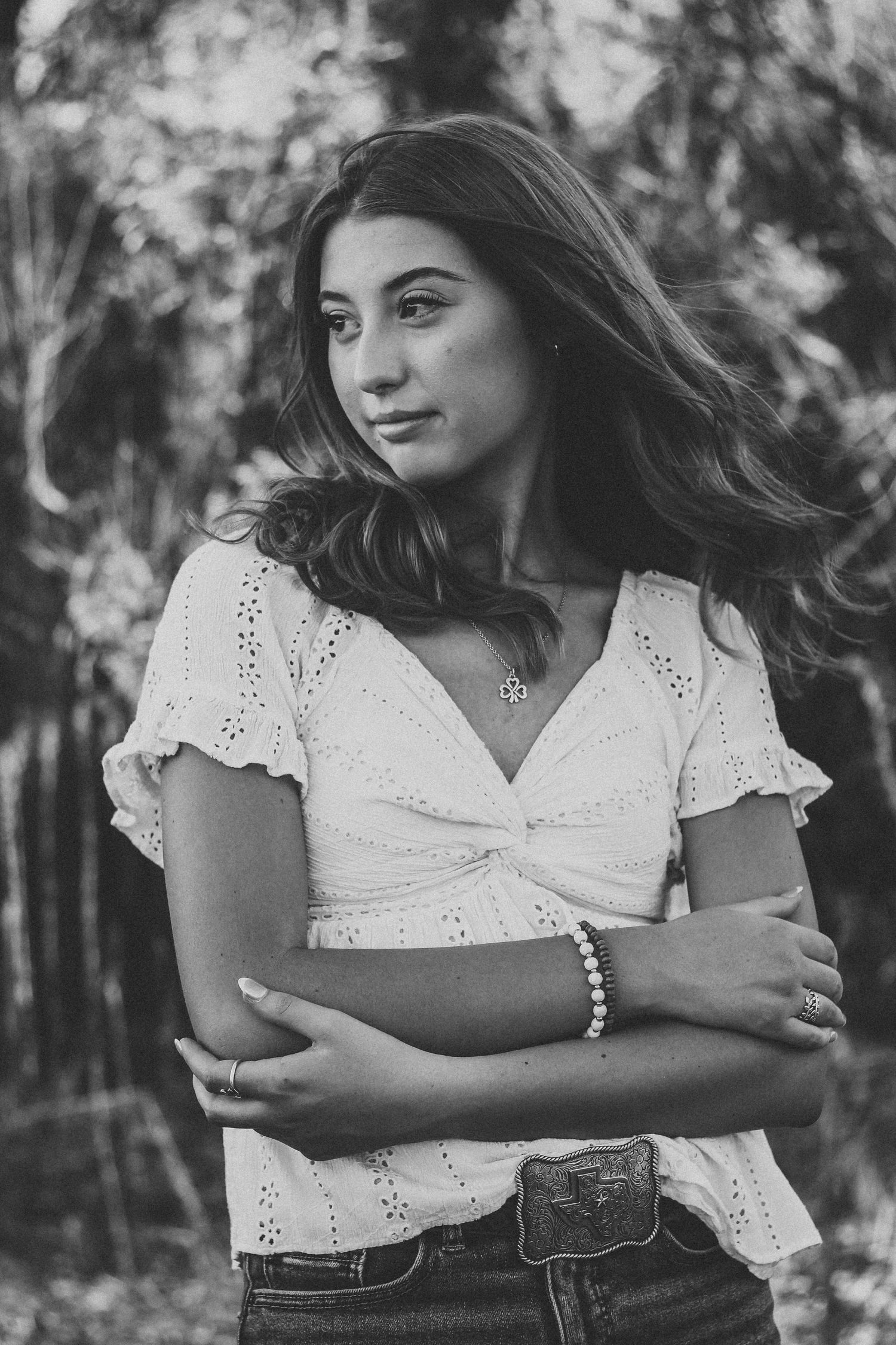 Black and white senior portrait session in Abilene TX featuring a high school senior with natural expression and soft light