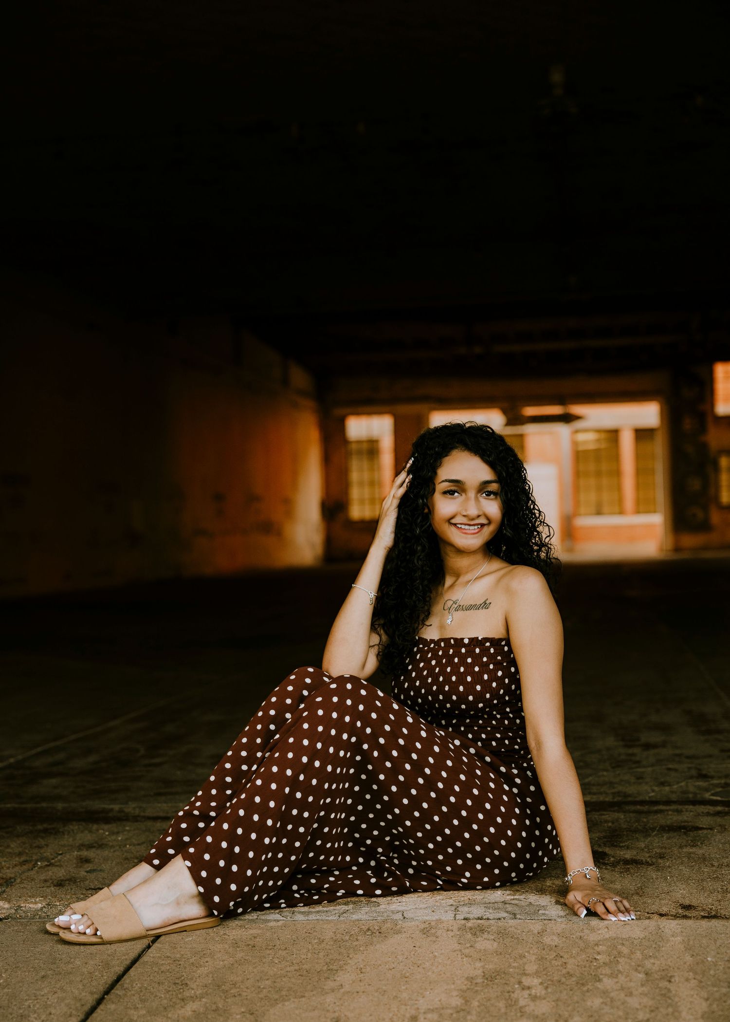 Class of 2027 Cooper High School senior posing at dusk in downtown Abilene during an outdoor senior photography session.