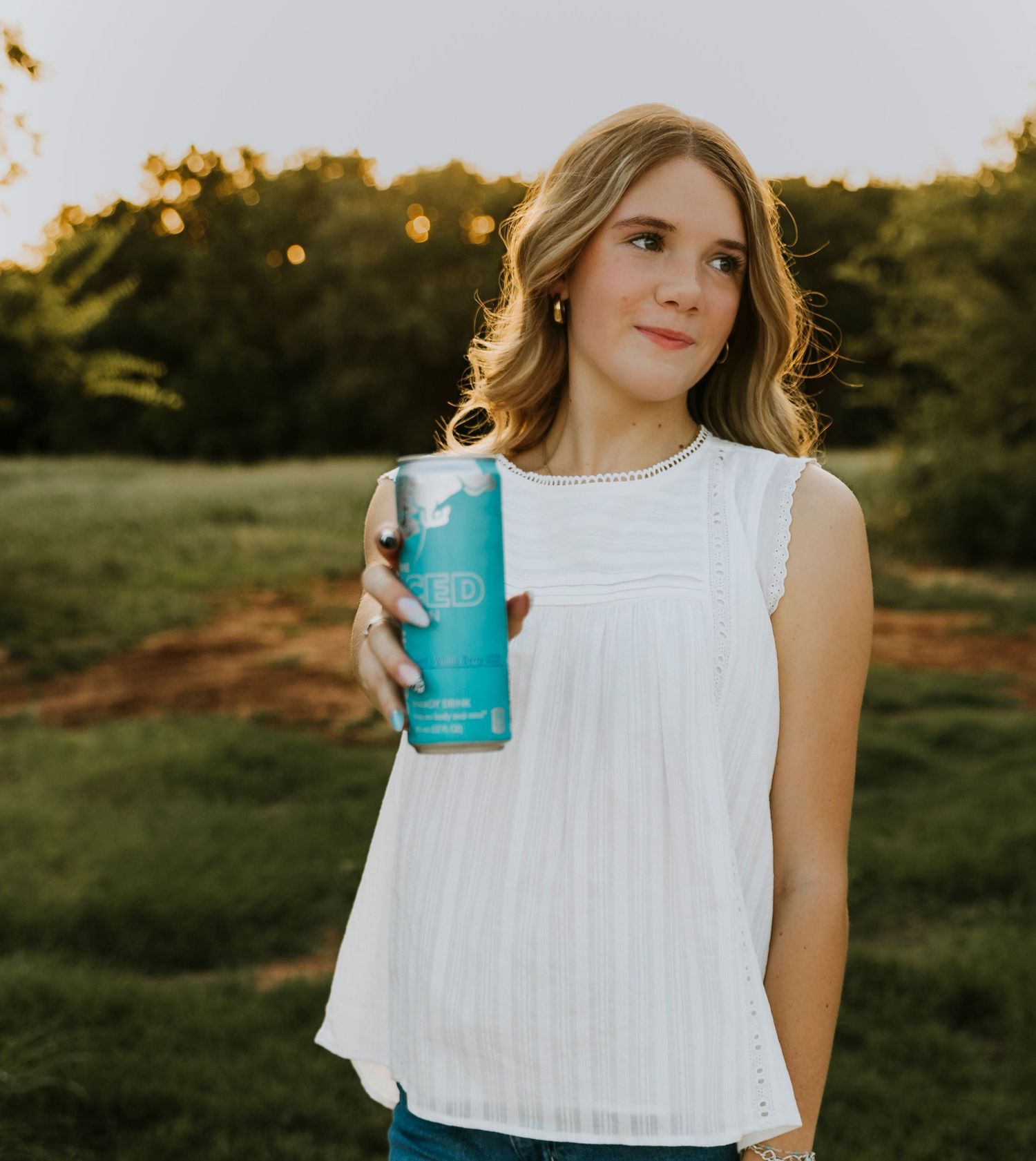 High School Senior holding a redbull during a senior session in Abilene, TX
