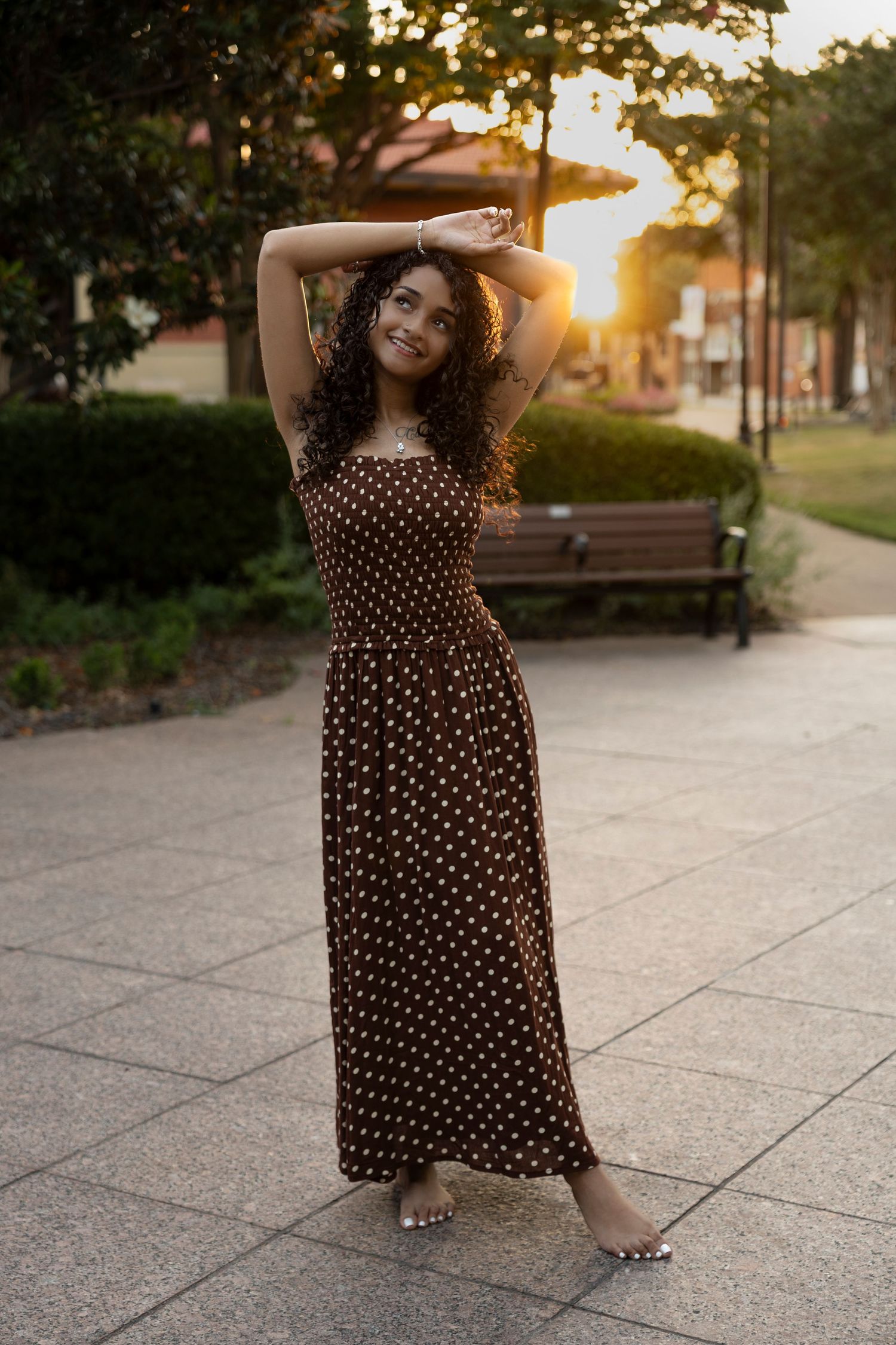 Class of 2027 Cooper High School senior posing at dusk in downtown Abilene during an outdoor senior photography session.