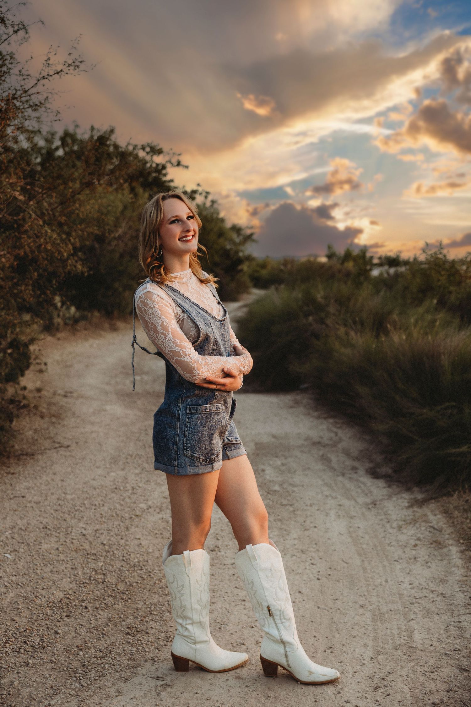 Class of 2027 senior portrait overlooking the lake at sunset during a scenic outdoor senior session in Abilene, Texas.