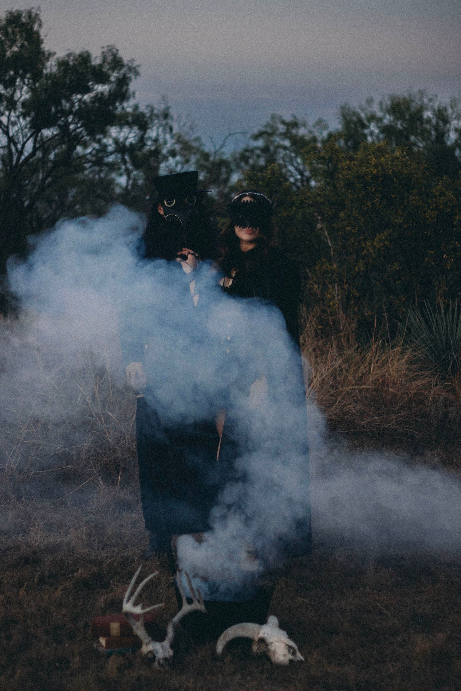 Moody witchy portrait session in Abilene TX using smoke effects and dramatic natural light