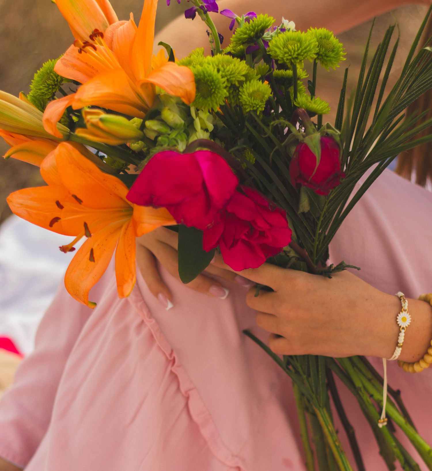 Colorful bouquet of flowers used as a prop for a creative senior photo session.