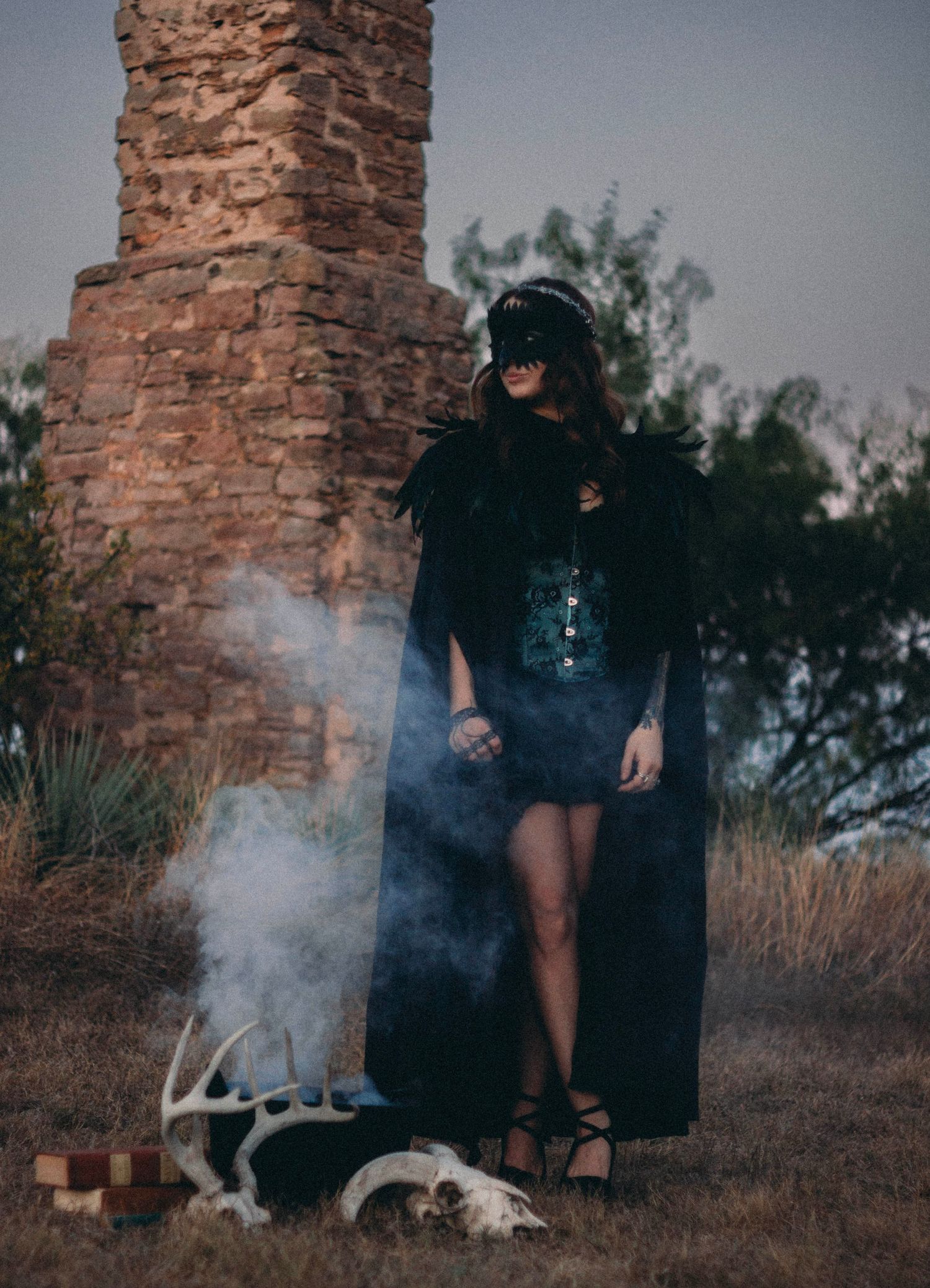 Spooky witchy portrait session in Abilene TX featuring smoke, ritual elements, and moody outdoor lighting