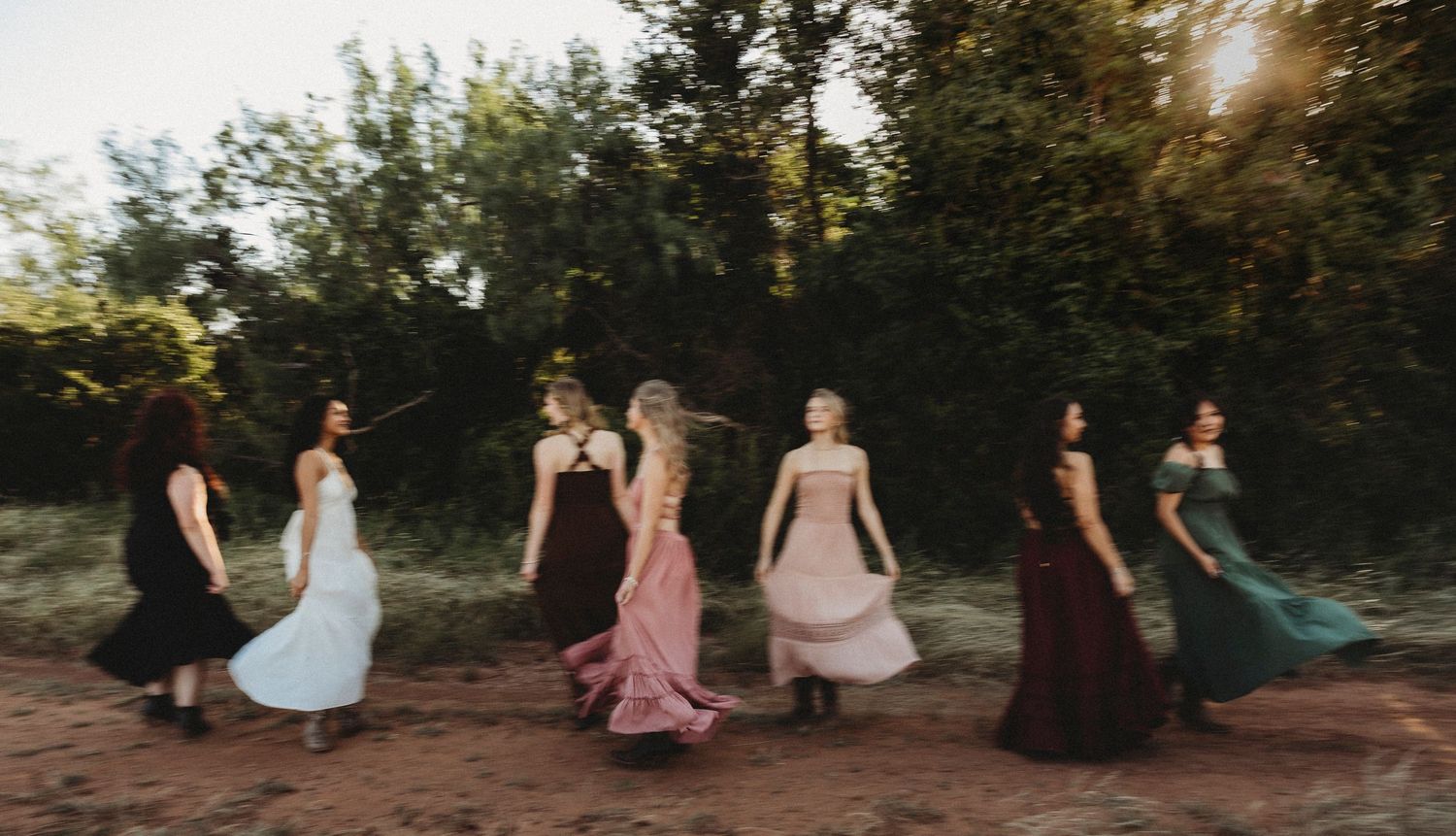 Shadow & Light Portraits Class of 2027 Senior Rep Team walking together during a golden hour outdoor senior photography session in Abilene,