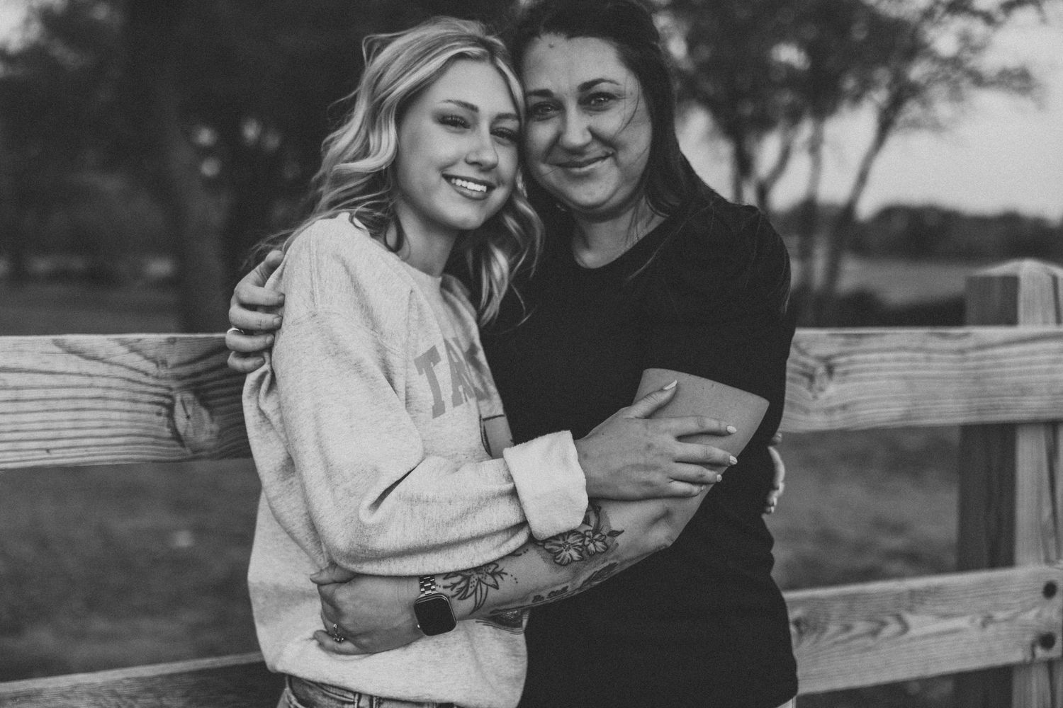 High school senior hugging mom during emotional senior photo session in Abilene TX
