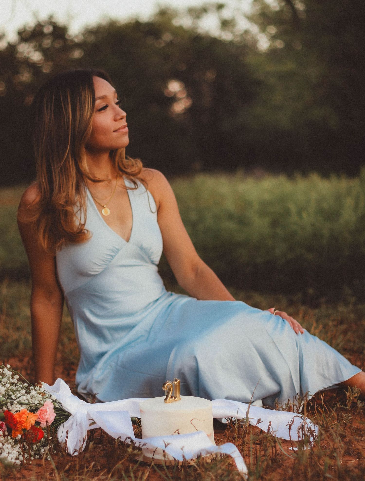 Creative 21st birthday portrait session in Abilene TX with styled outdoor setup and natural light