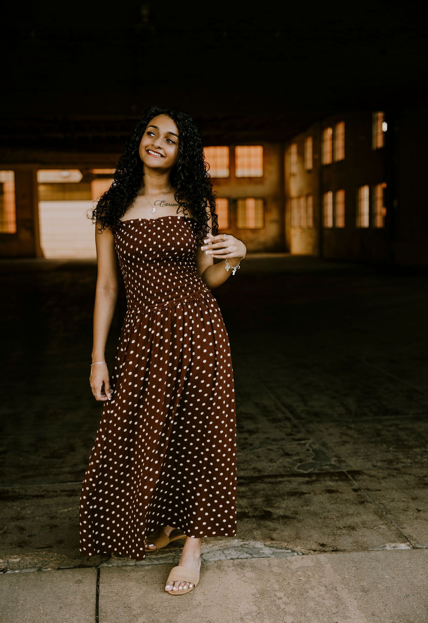 Class of 2027 Cooper High School senior posing at dusk in downtown Abilene during an outdoor senior photography session.