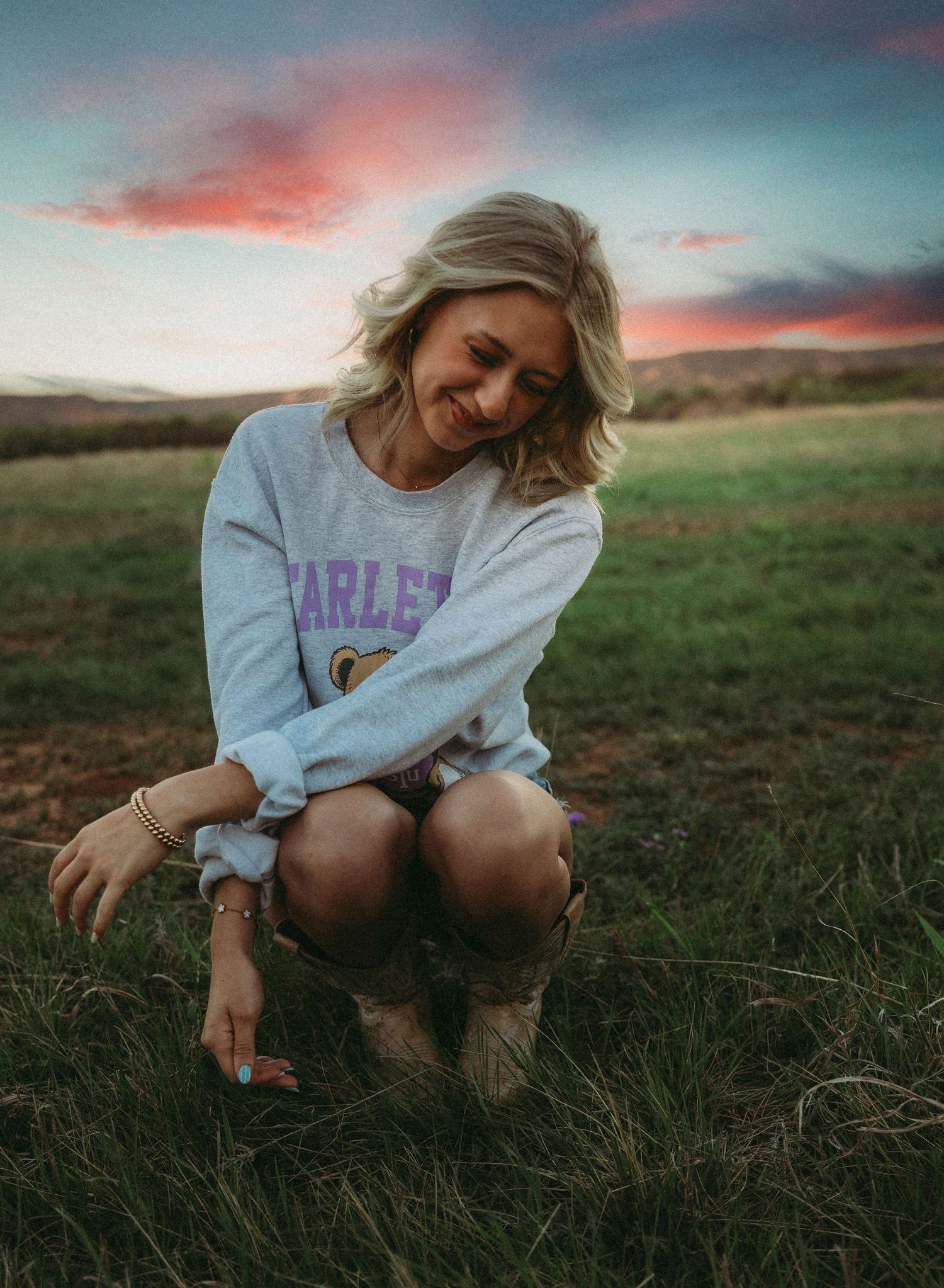 Senior portrait session at sunset in Abilene Texas with colorful sky