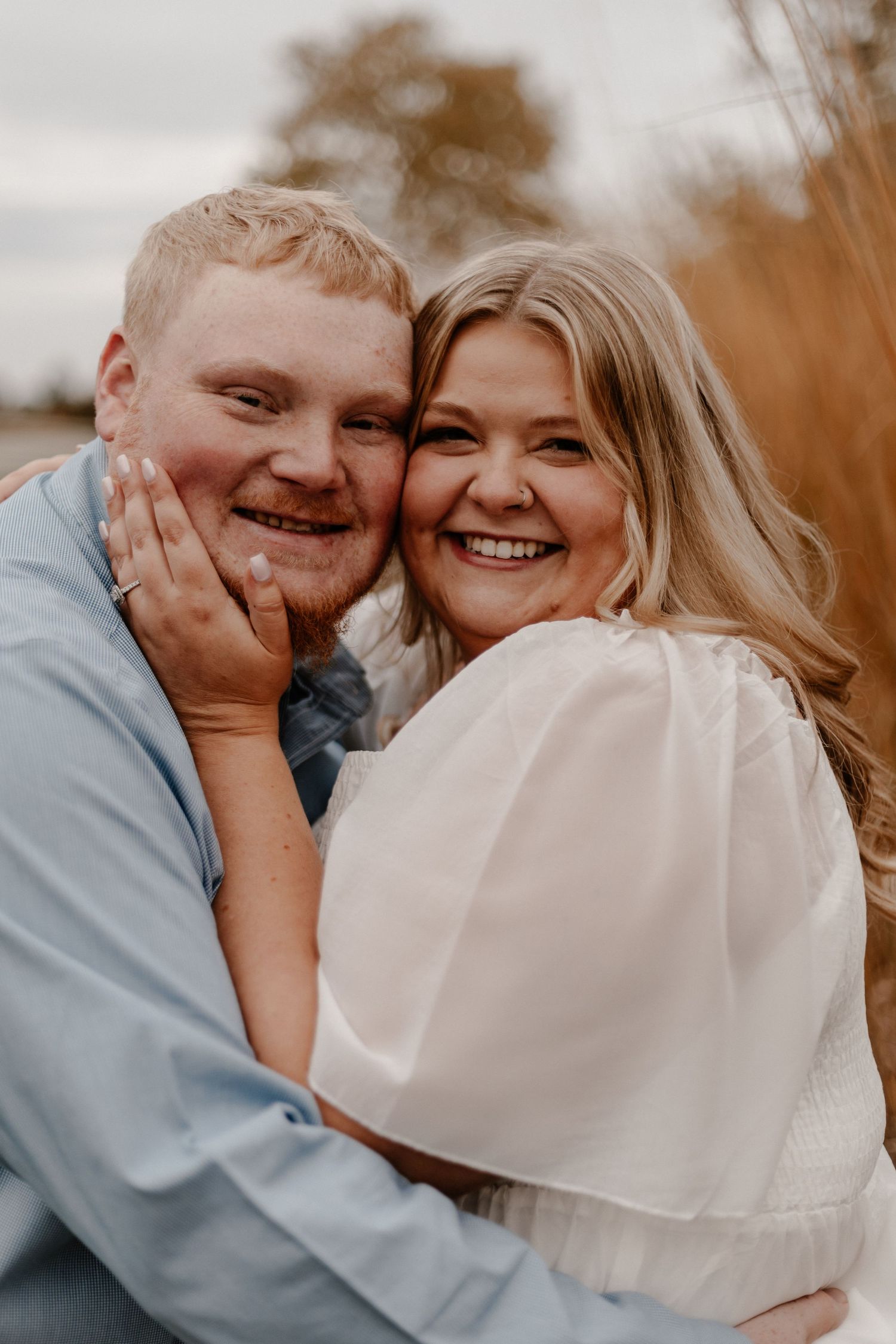 Intimate couple portrait session in warm autumn lighting.