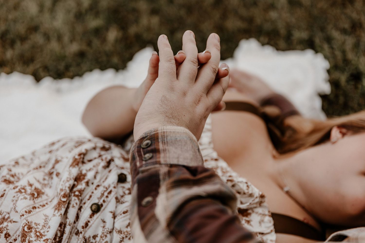 Close-up romantic moments captured in a dreamy outdoor setting.