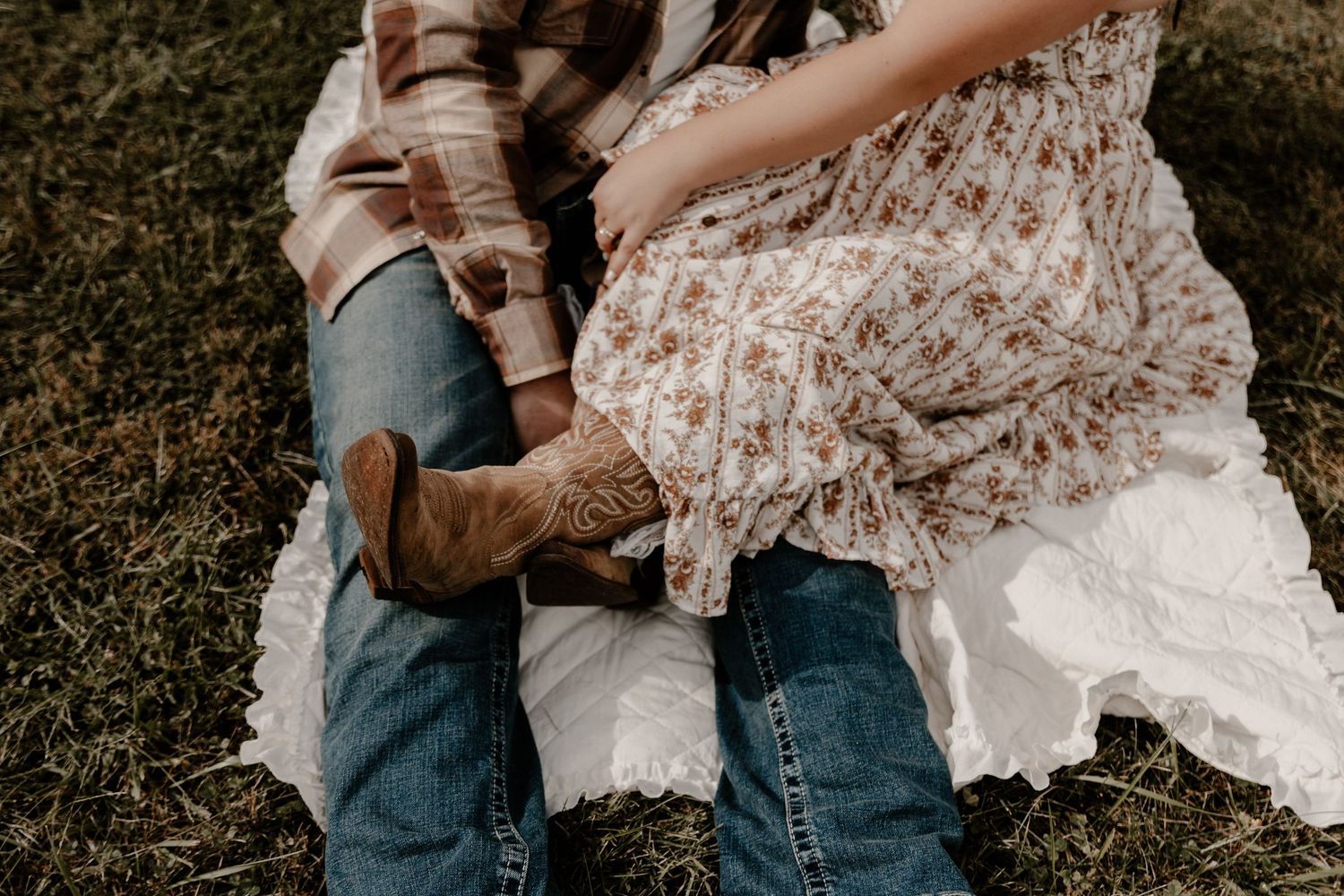 Intimate moments captured between a couple in a rural setting.