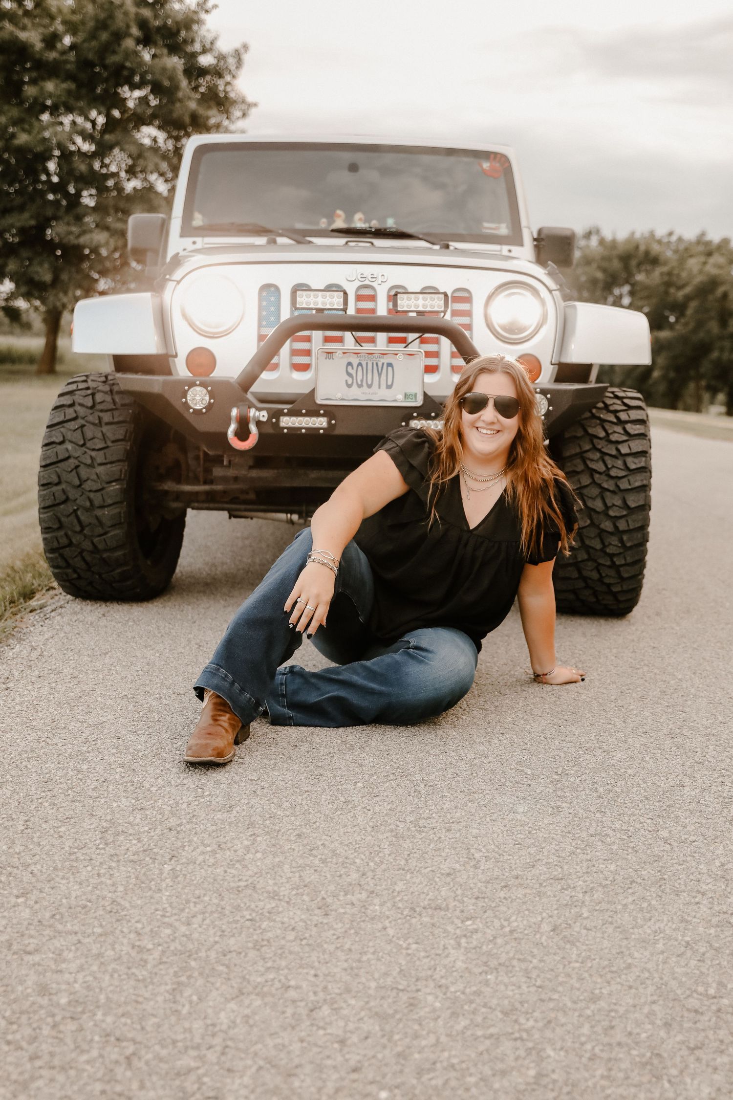 Creative photo series with vintage Jeep vehicle on gravel road.