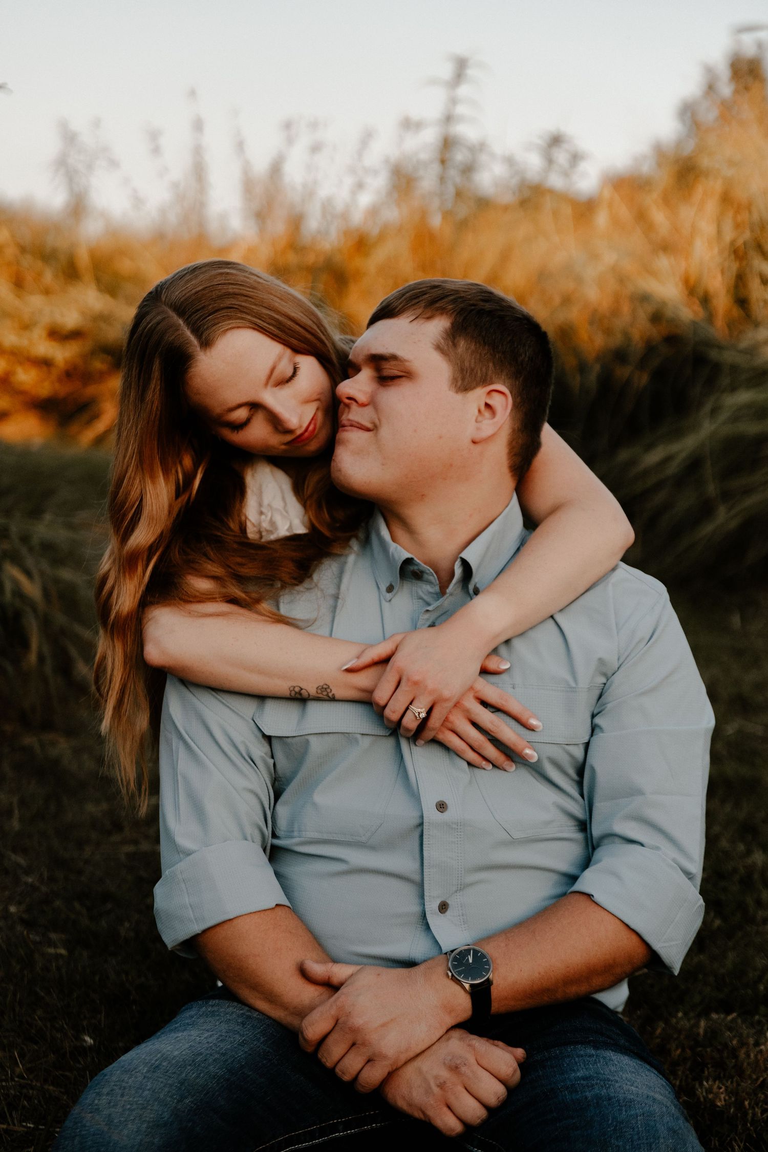 Intimate couple portrait in warm evening light.