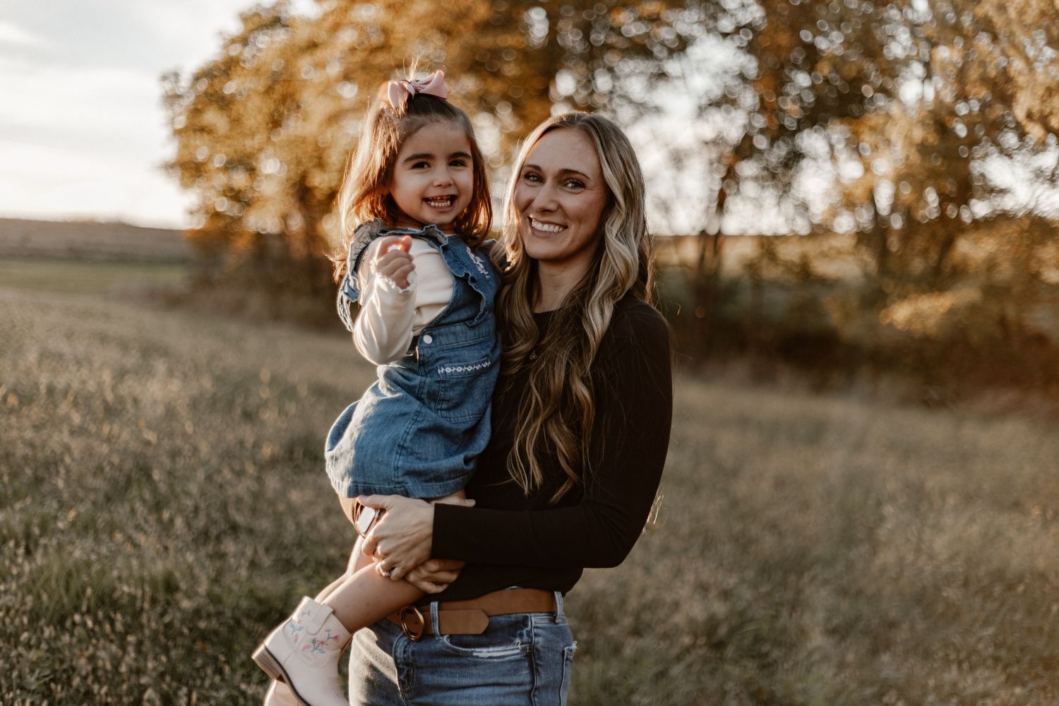 Lifestyle family photos captured during golden hour in natural setting.